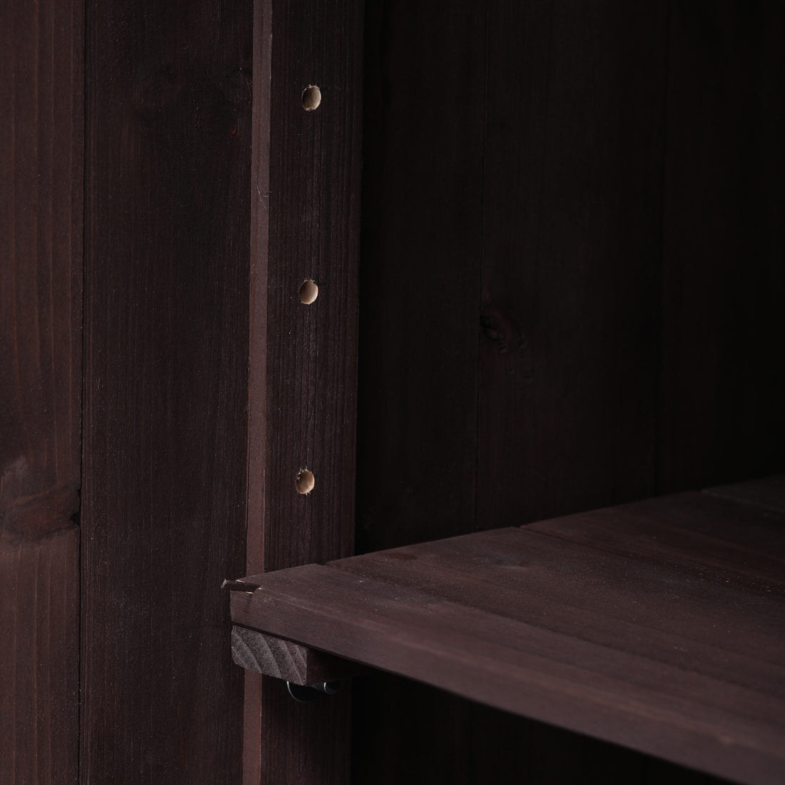 Close-up of the adjustable interior shelf inside the black Limoges outdoor kitchen island showing flexible storage configuration for cookware grilling tools and outdoor kitchen supplies