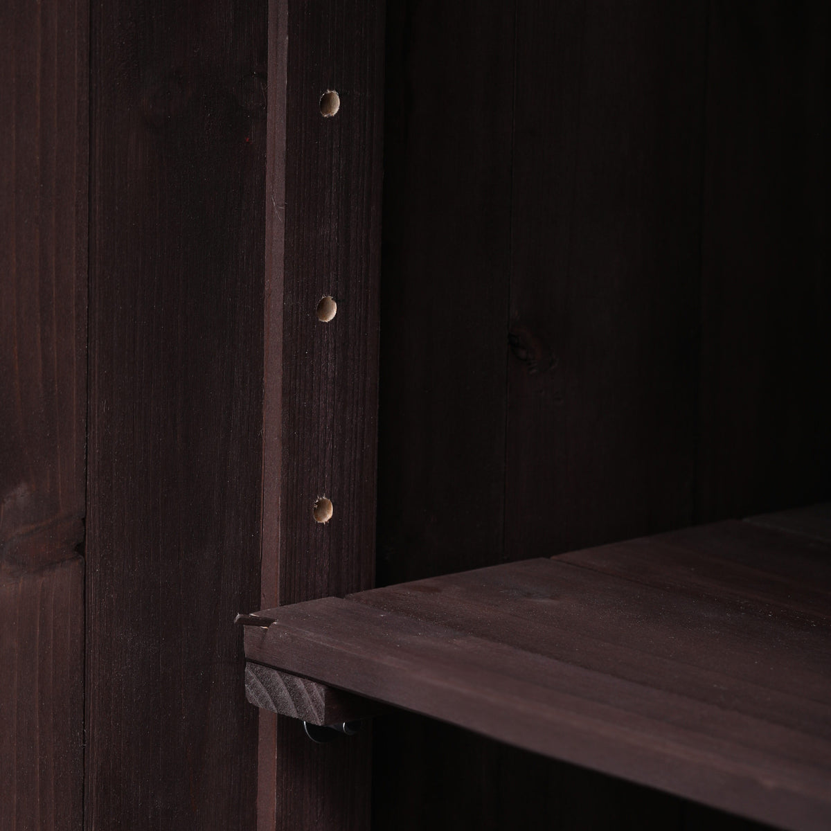 Close-up of the adjustable interior shelf inside the black Limoges outdoor kitchen island showing flexible storage configuration for cookware grilling tools and outdoor kitchen supplies