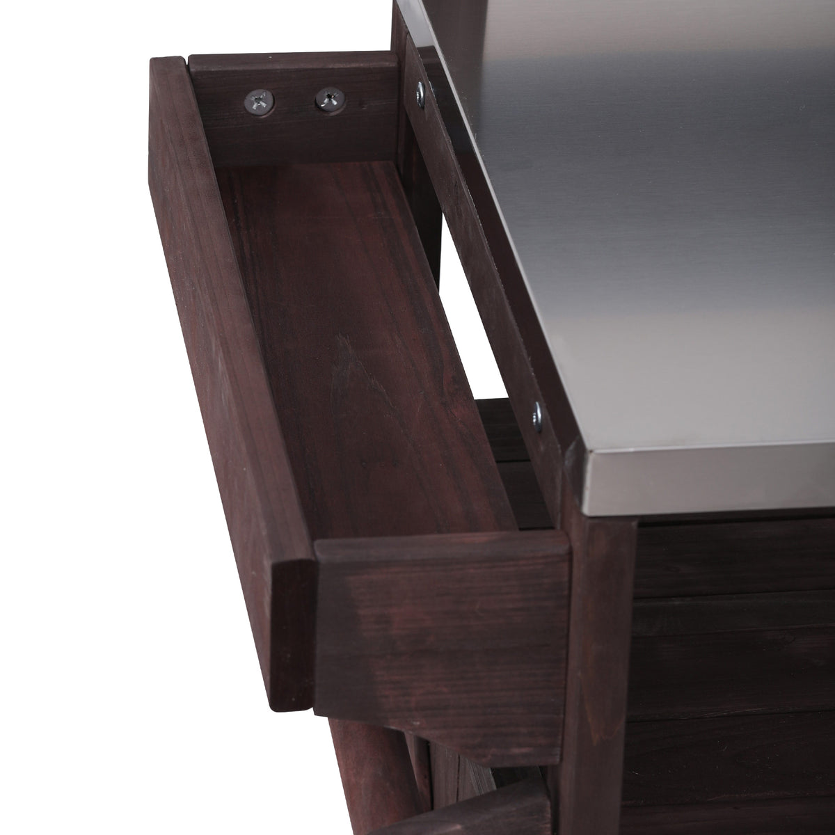 Close-up of the side storage tray beside the stainless steel countertop on the black Limoges outdoor kitchen island for organizing condiments grilling tools and outdoor cooking essentials