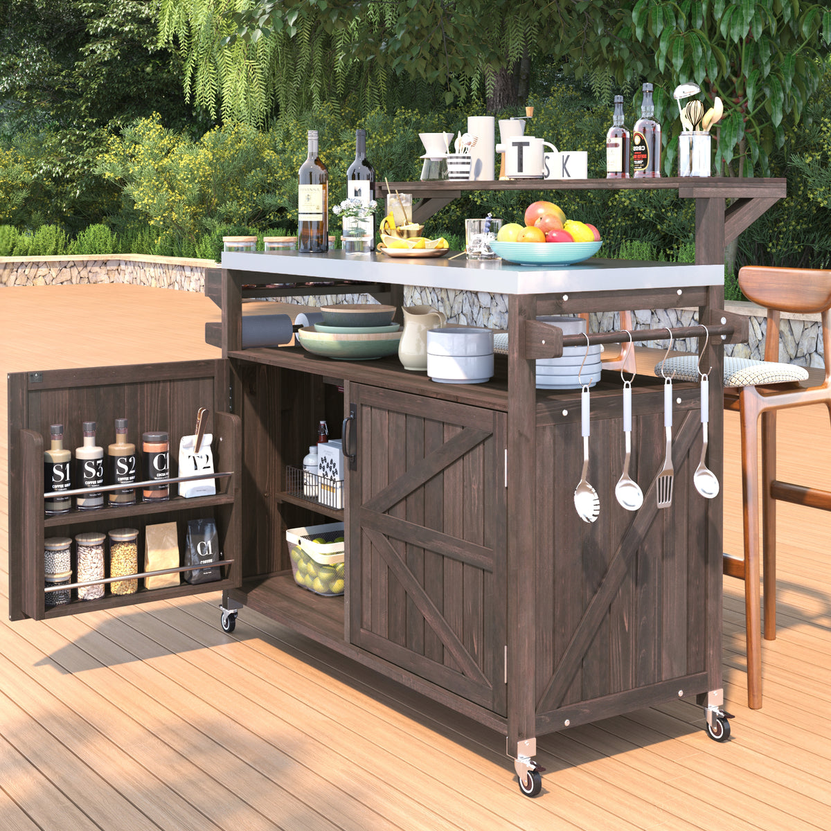 Brown Limoges rolling outdoor kitchen island with stainless steel countertop open cabinet storage spice rack utensil hooks and caster wheels styled on an outdoor patio deck