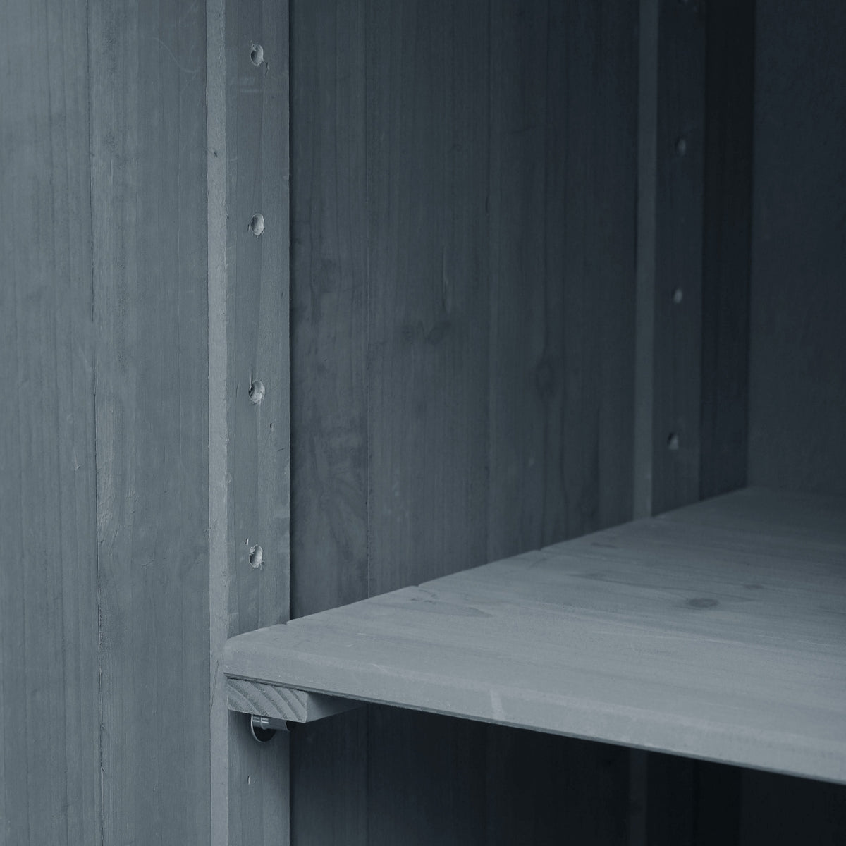 Close-up of the adjustable interior shelf inside the gray blue Limoges outdoor kitchen island showing customizable storage space for cookware grilling tools and outdoor kitchen essentials