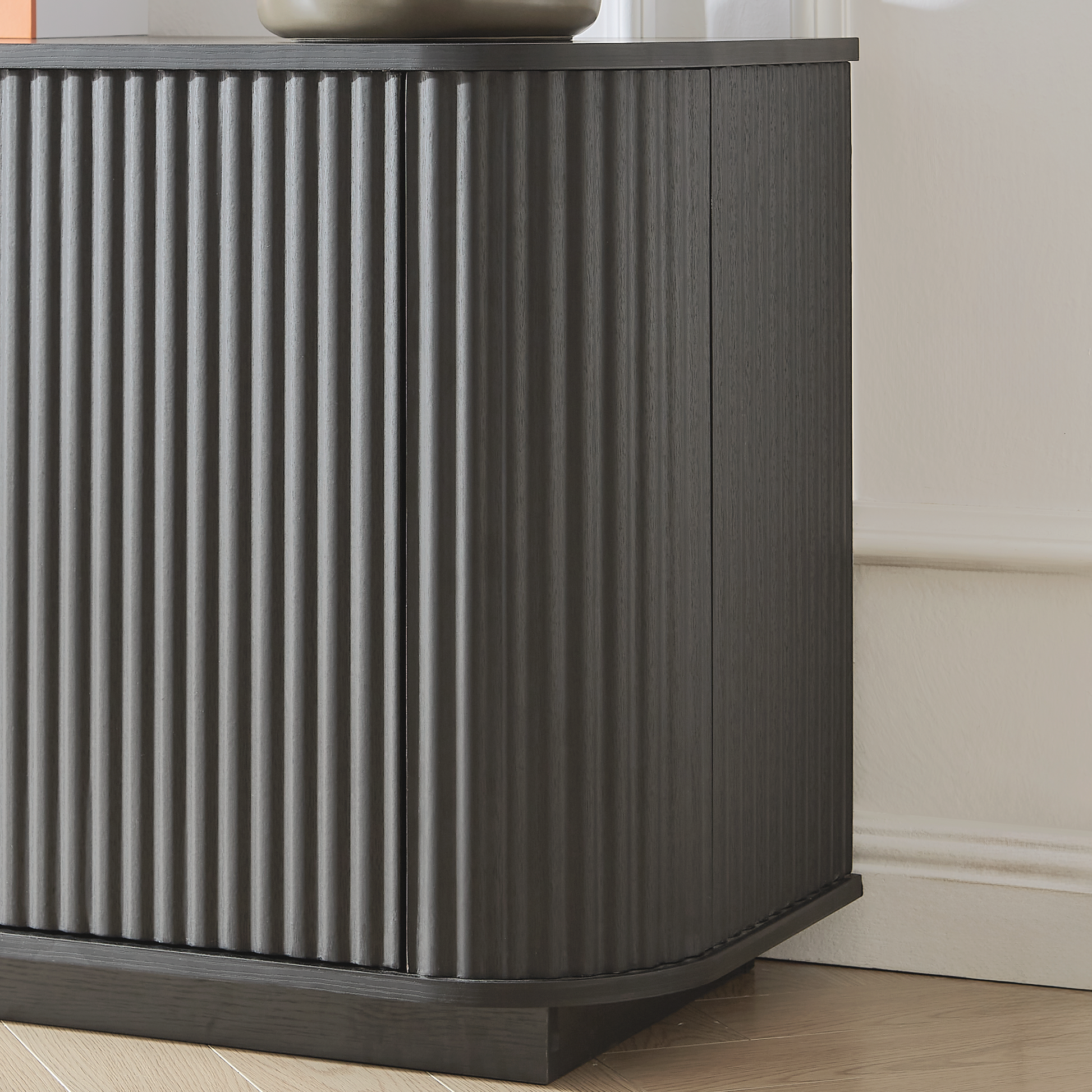 Lund black TV stand showing cabinet door hinge detail