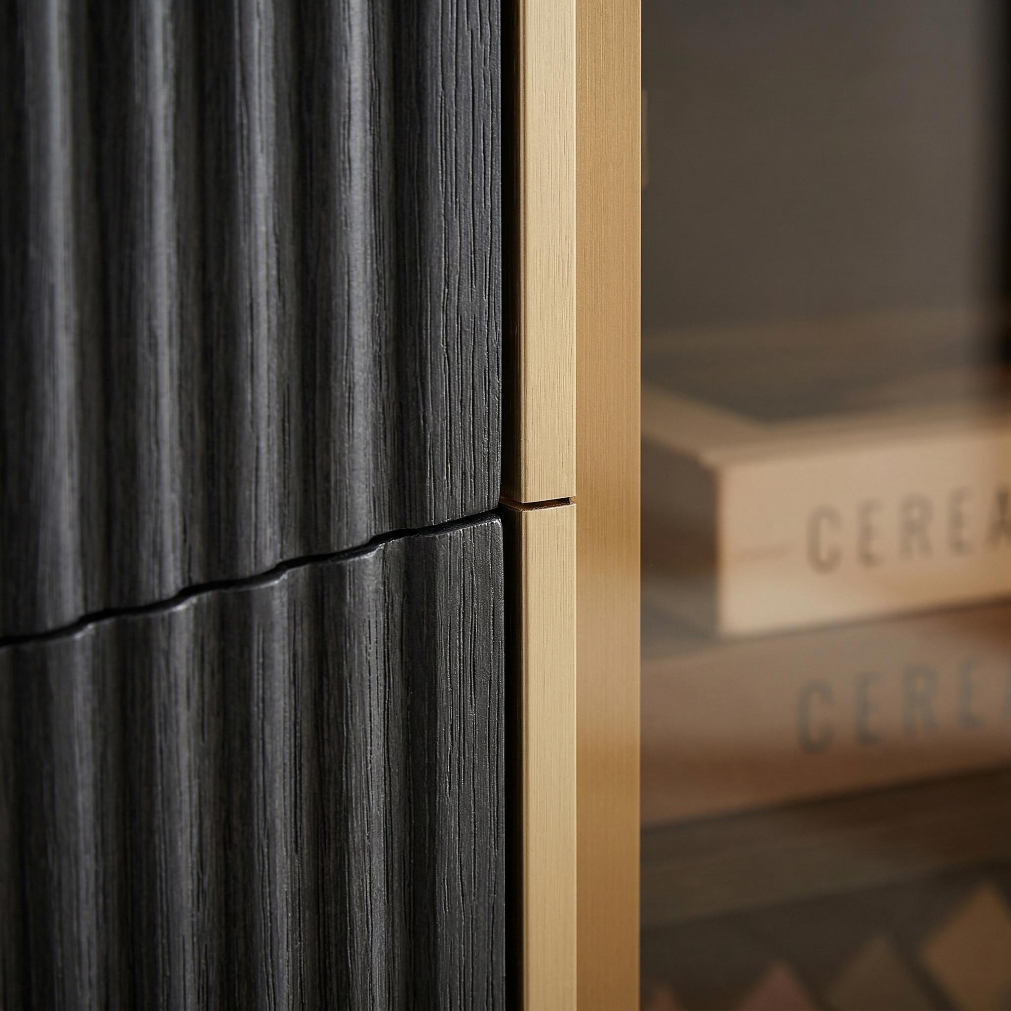 Lund black TV stand showing fluted cabinet edge and frame detail
