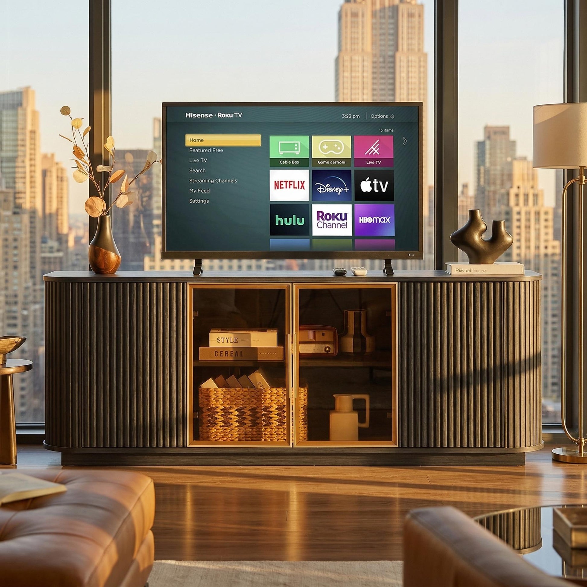Lund black tv stand showing a television above illuminated glass cabinet storage