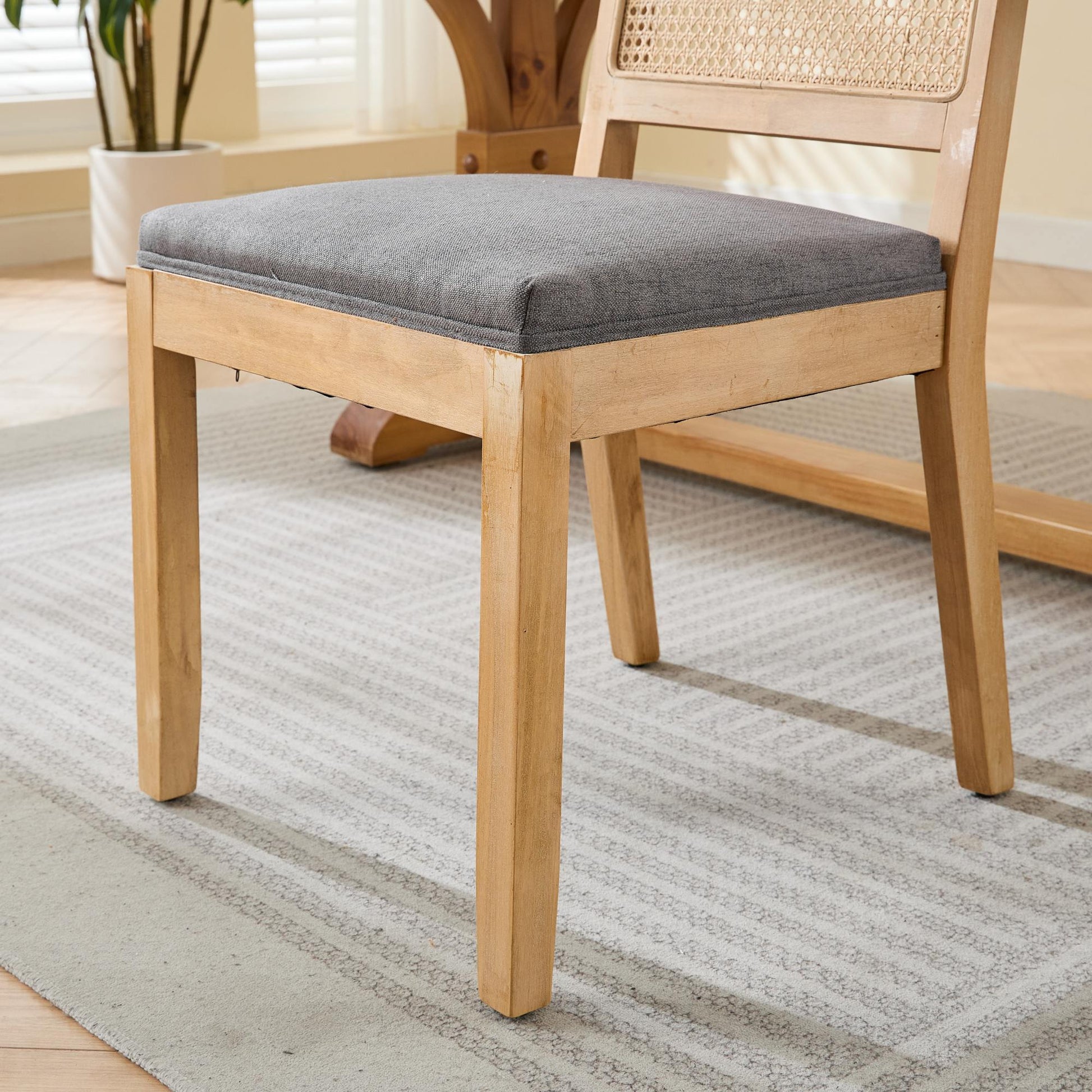 Maggiore gray dining chair close-up of the upholstered seat and solid rubberwood frame