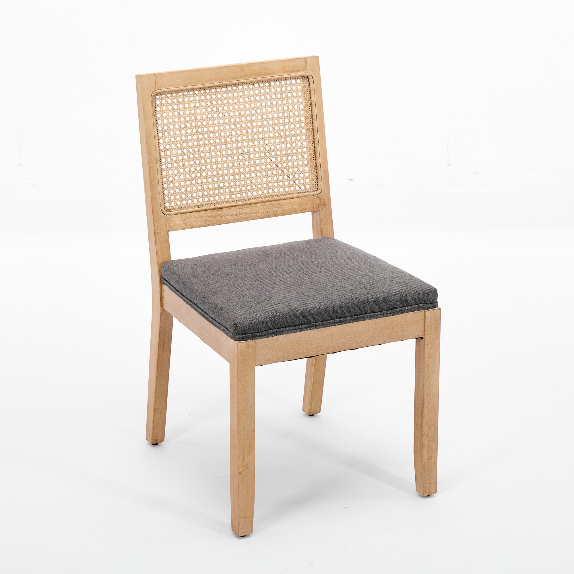 Maggiore gray dining chair front angled view with woven cane back on white background