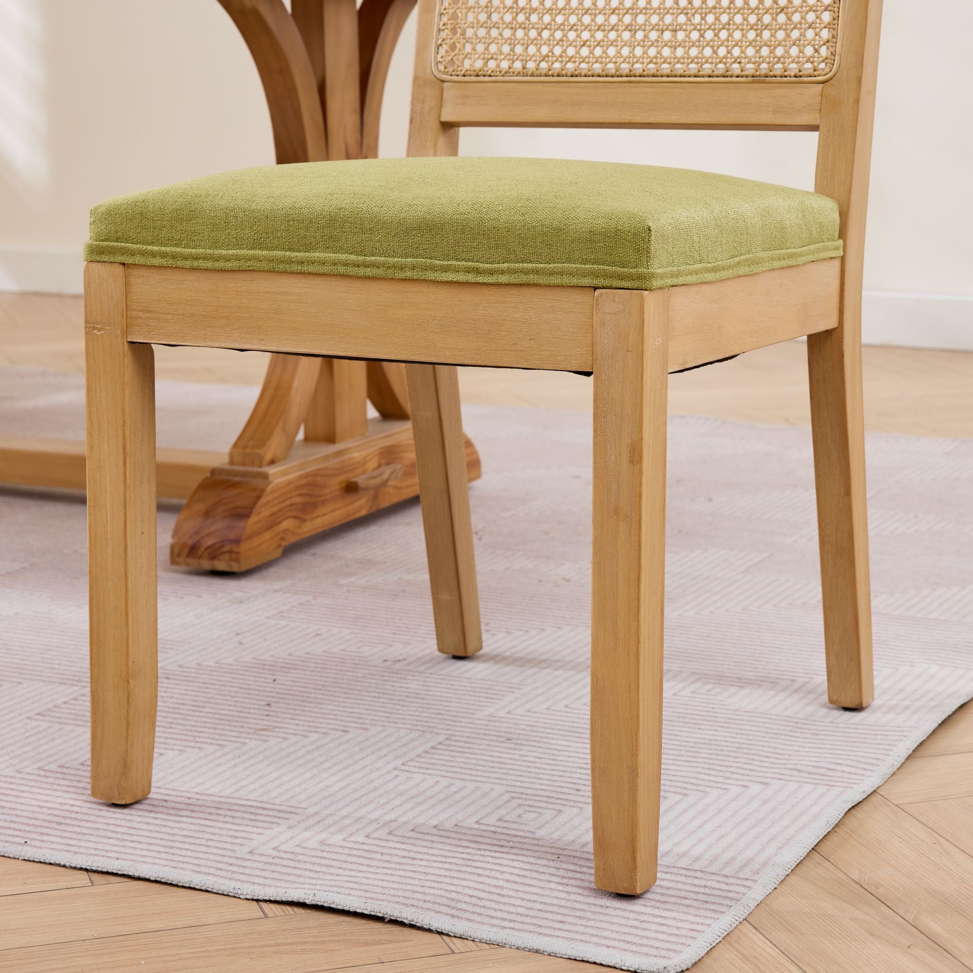 Maggiore green dining chair close-up of the upholstered seat and solid rubberwood frame