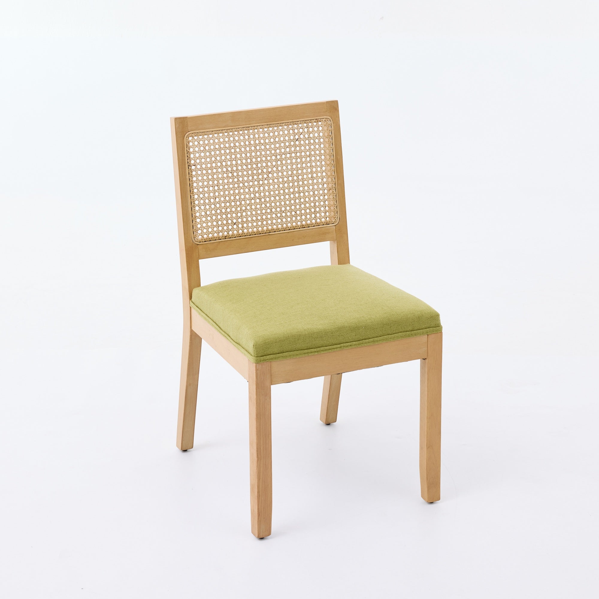 Maggiore green dining chair front angled view with woven cane back on white background