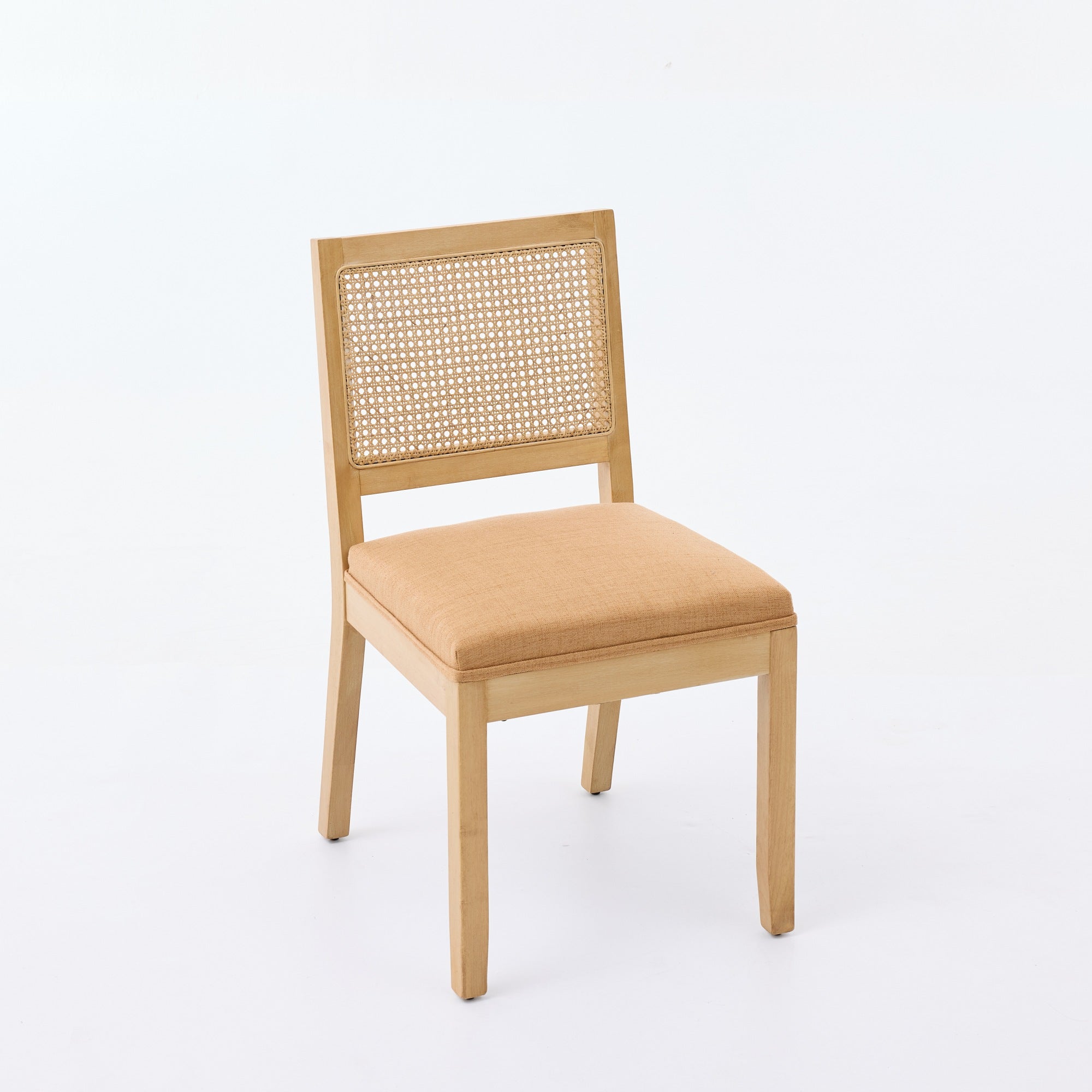 Maggiore orange rattan dining chair side view with solid rubberwood legs on white background