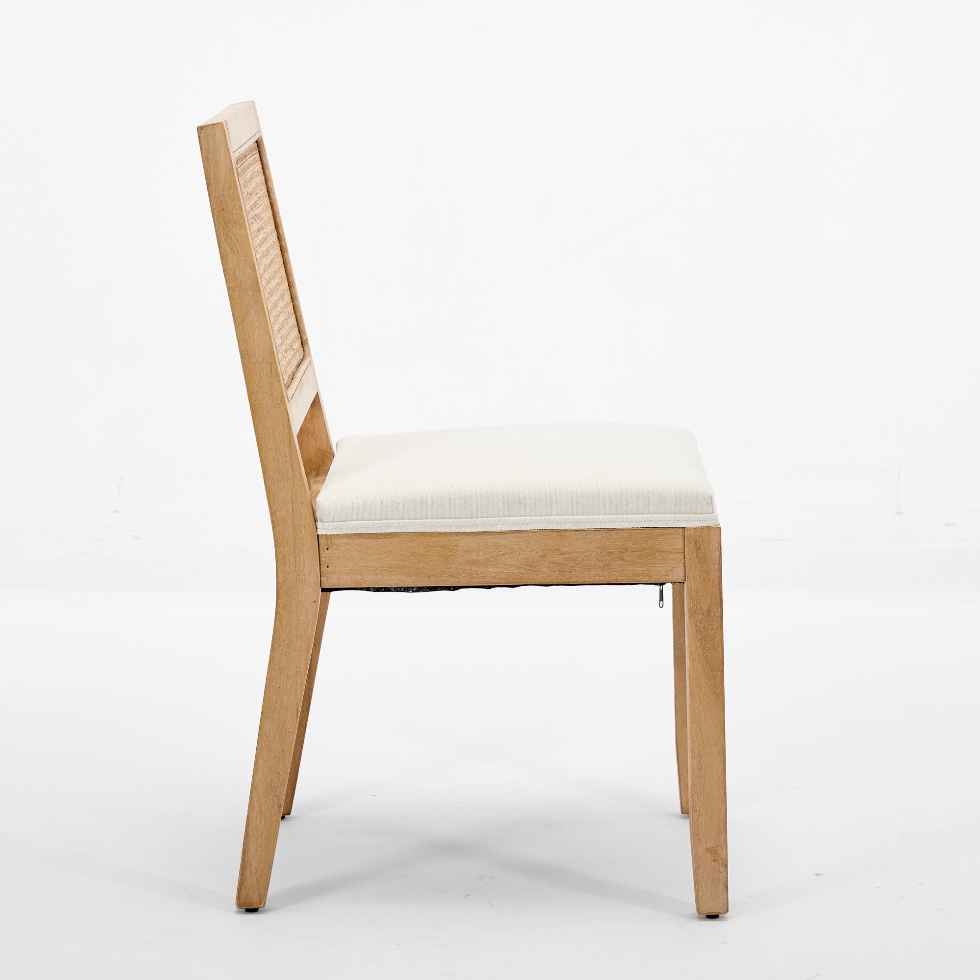 Maggiore white dining chair front angled view with woven rattan back on white background