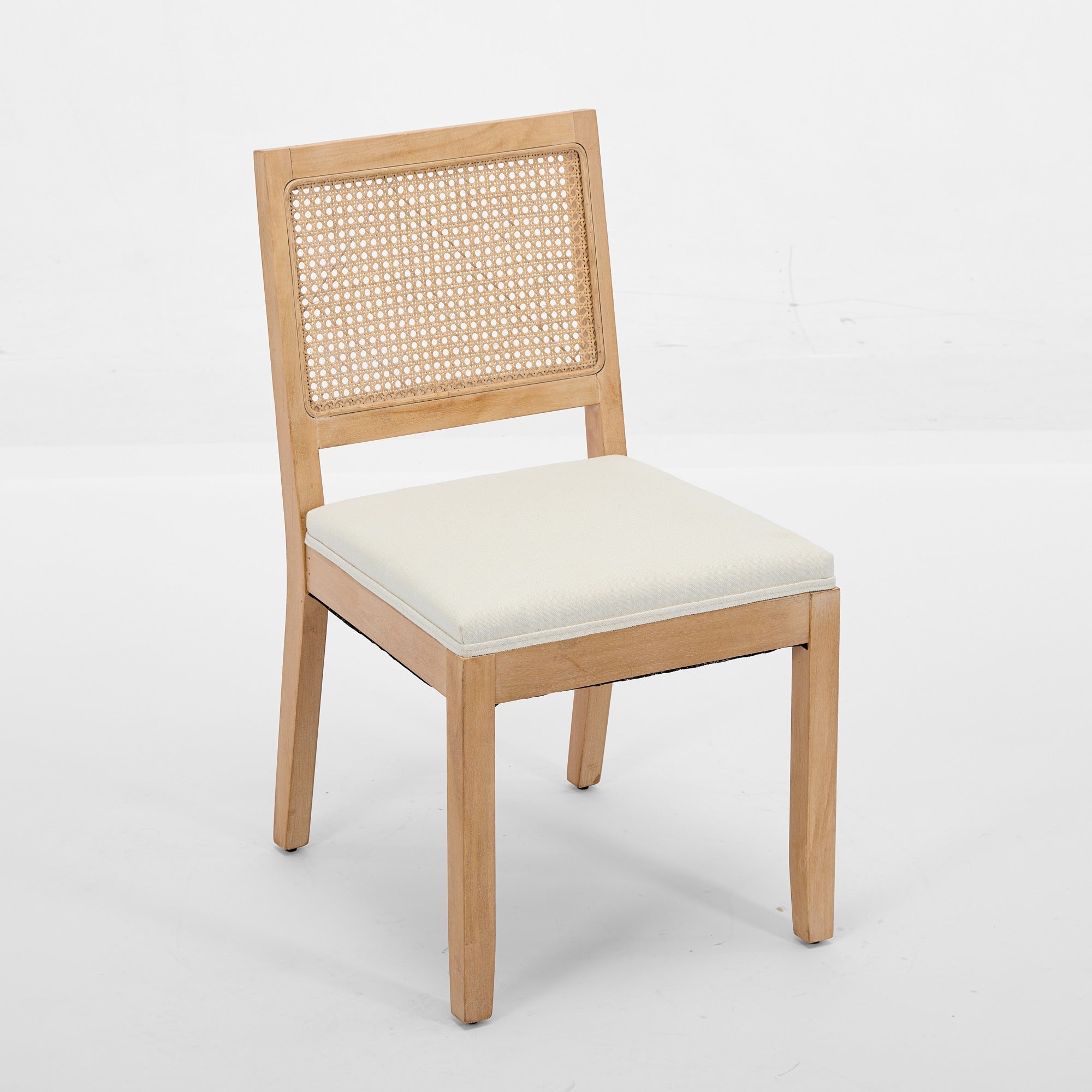 Maggiore white dining chair front angled view with woven rattan back on white background