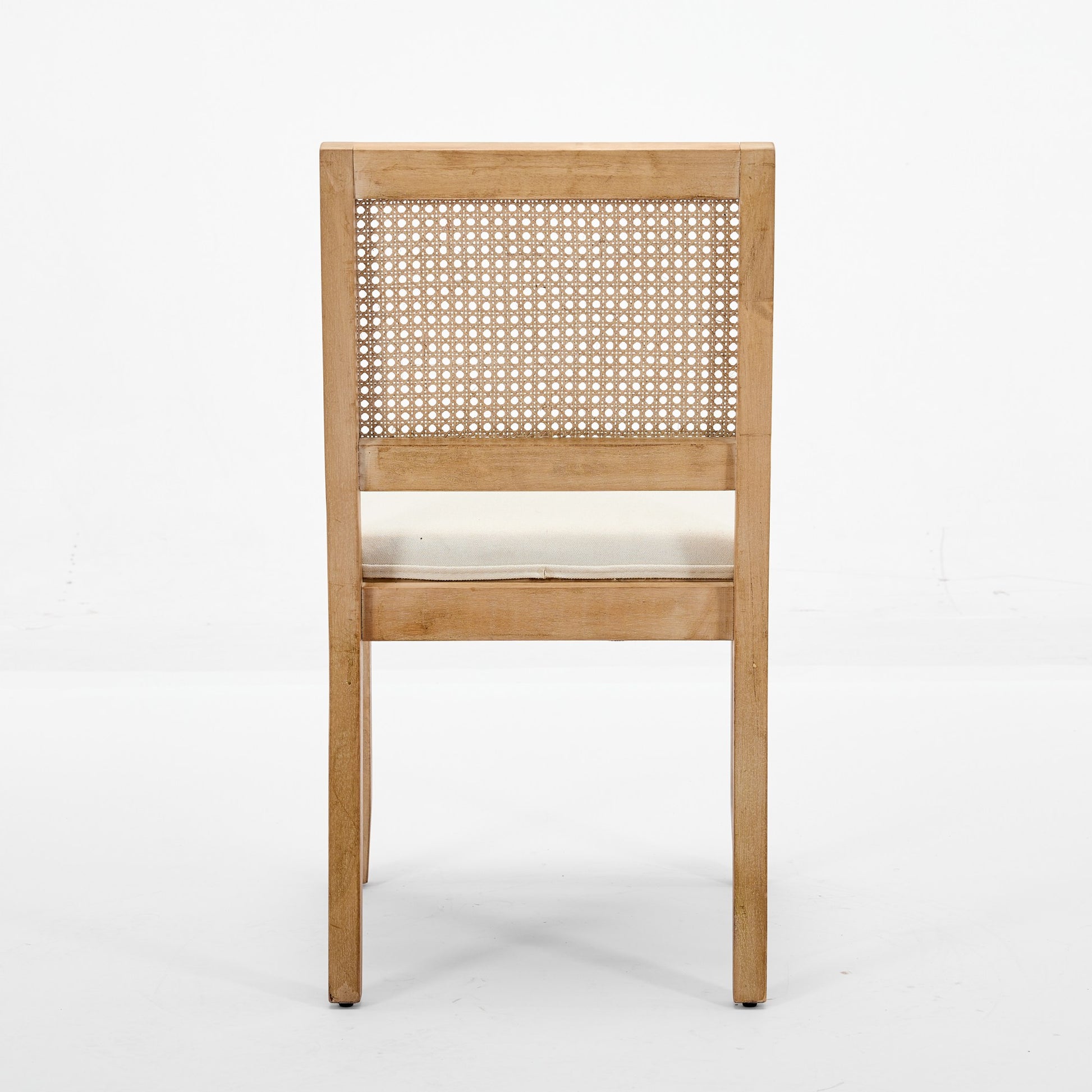 Maggiore white dining chair rear view showing the woven cane backrest on white background