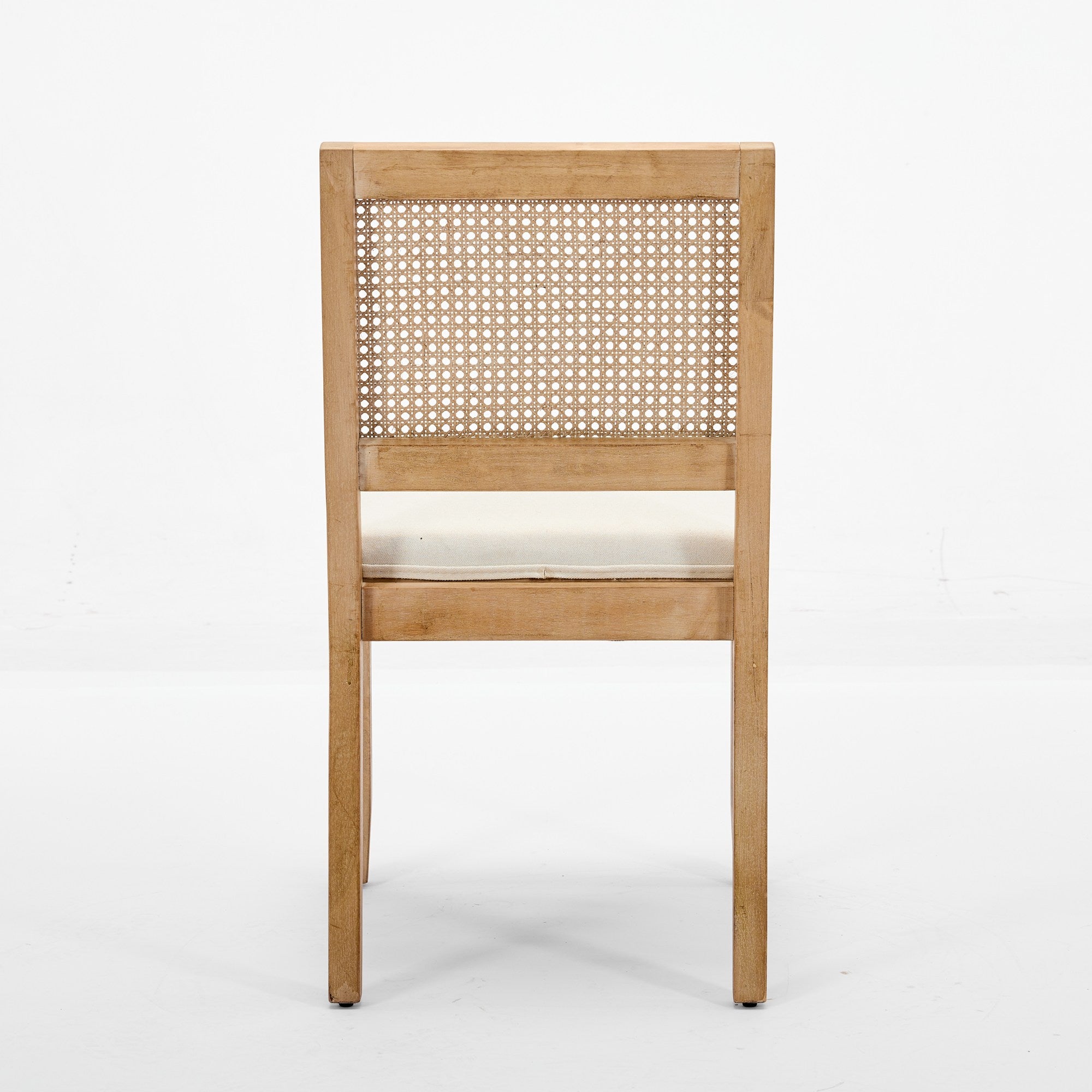 Maggiore white dining chair rear view showing the woven cane backrest on white background