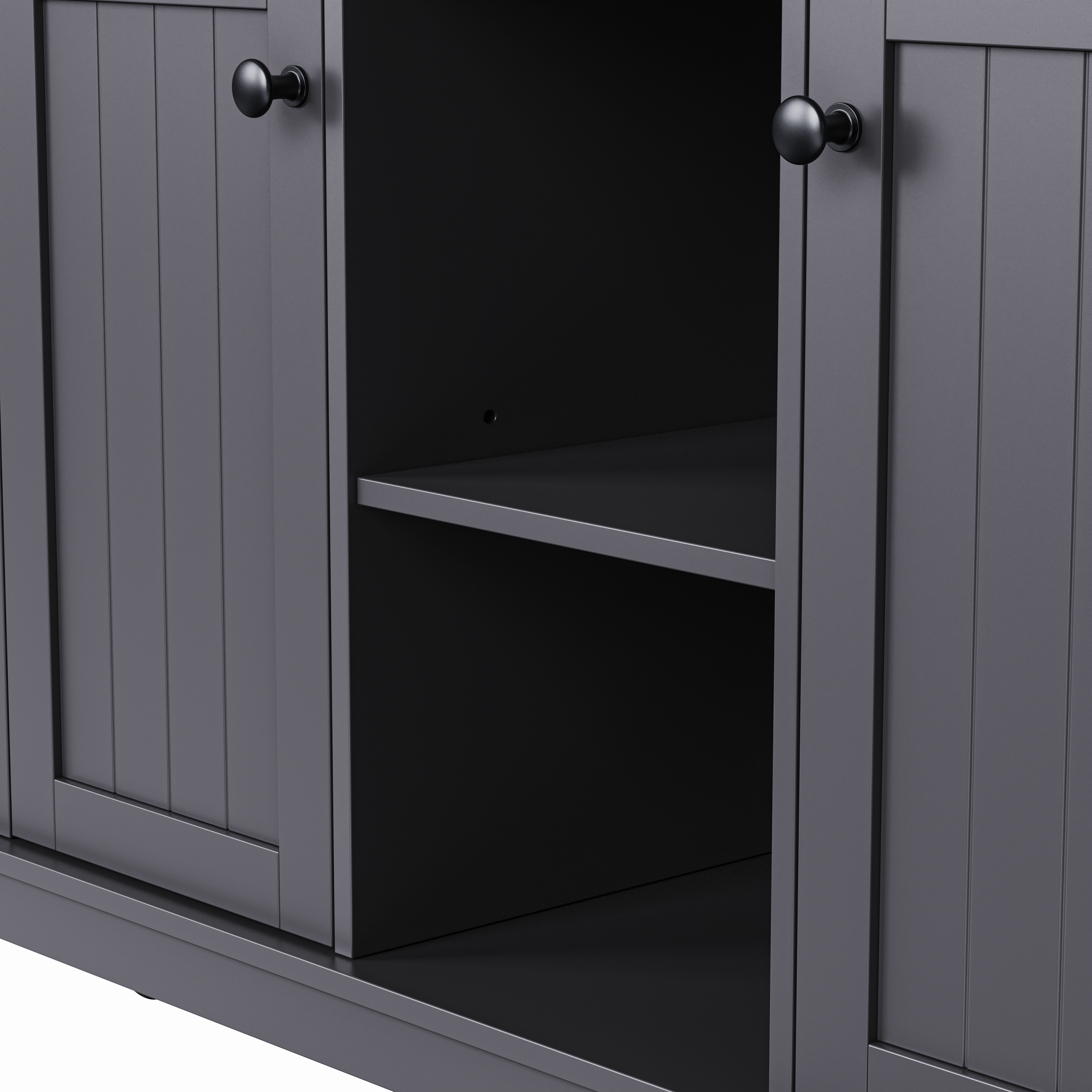 Close-up of Maui black rolling kitchen island featuring adjustable open storage shelf with farmhouse cabinet doors and black round knobs