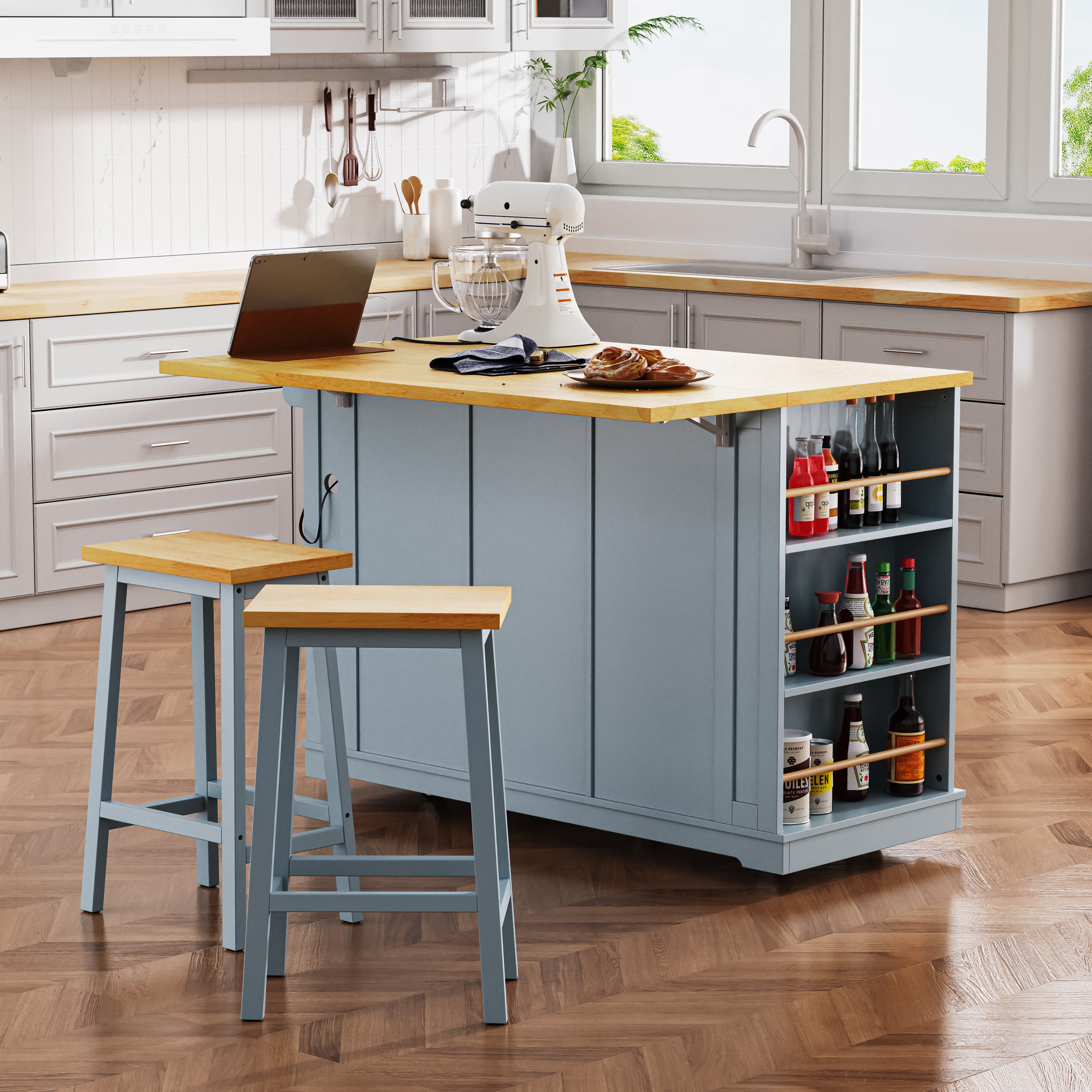 Rear view of Maui gray blue rolling kitchen island with expanded drop leaf breakfast bar open side storage shelves and matching stools in modern kitchen scene