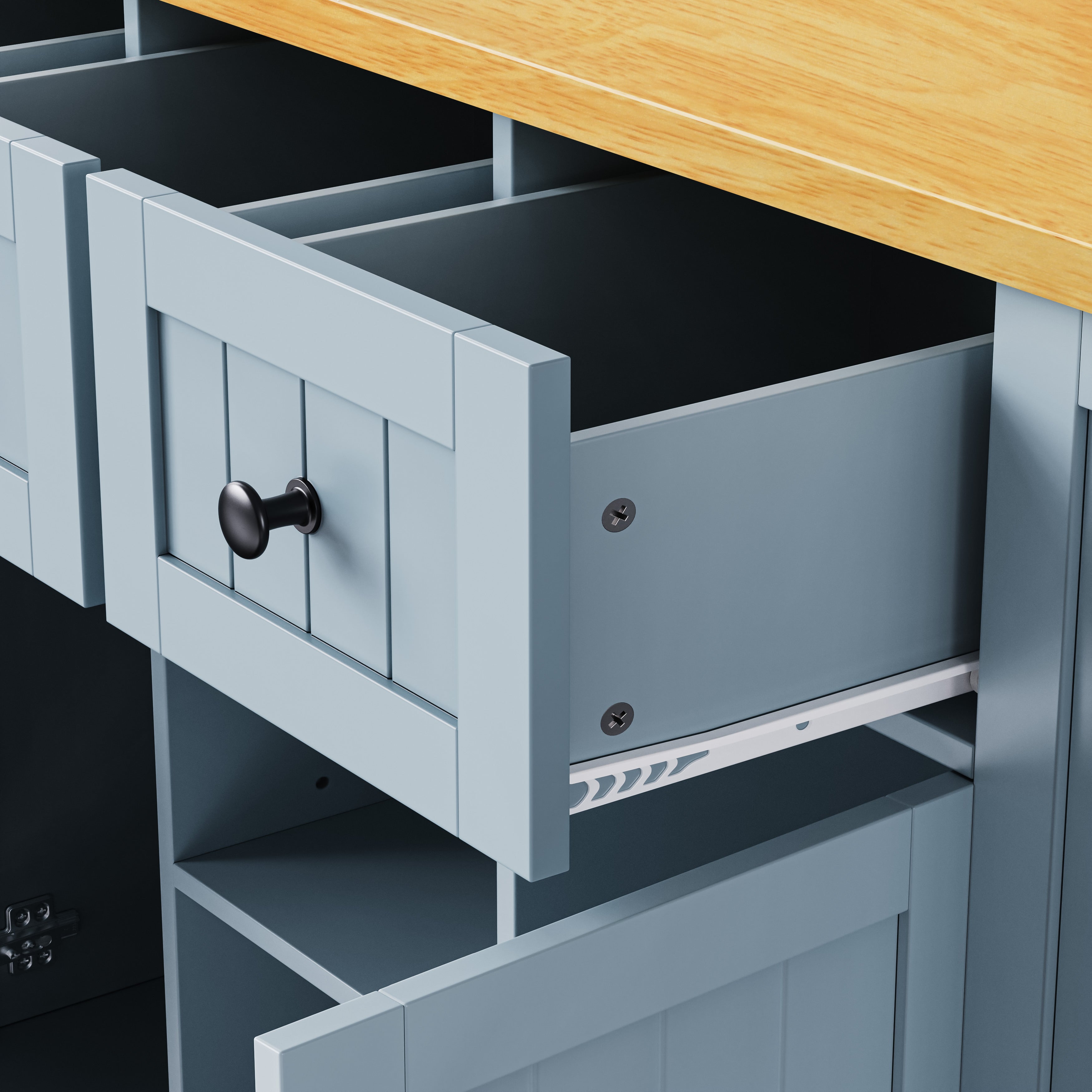 Close-up detail of Maui gray blue rolling kitchen island featuring spacious storage drawer with smooth slide rails and farmhouse panel design