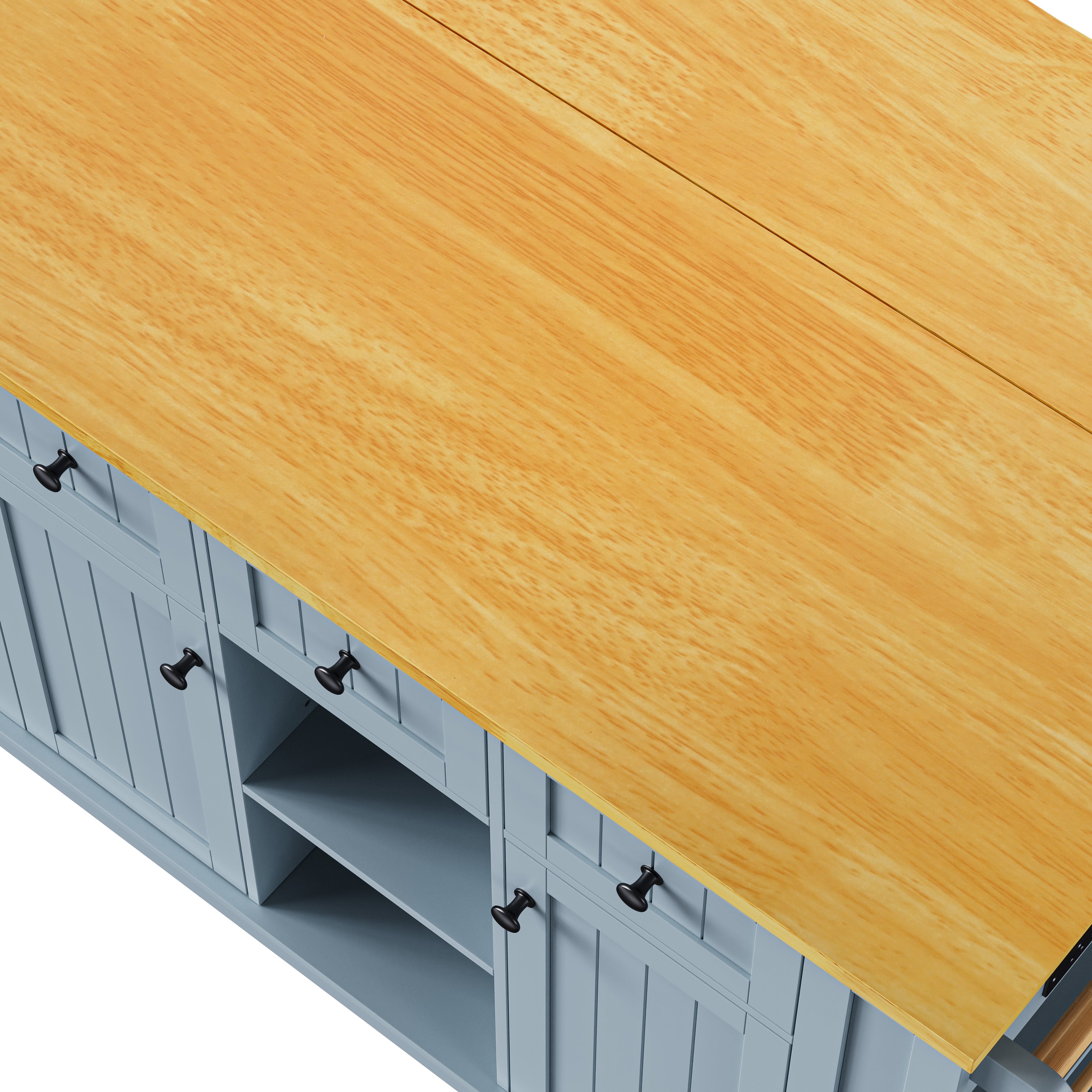 Close-up top view of Maui gray blue rolling kitchen island featuring natural wood grain countertop and expandable drop leaf surface design