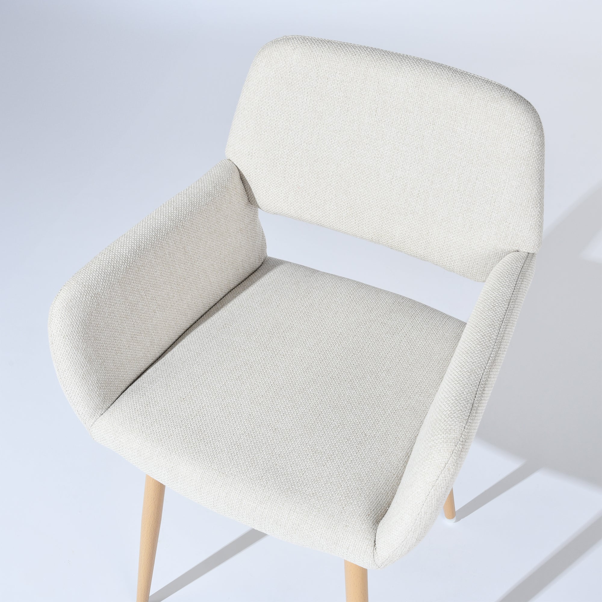 Mayfair beige fabric dining chair showing woven upholstery texture detail