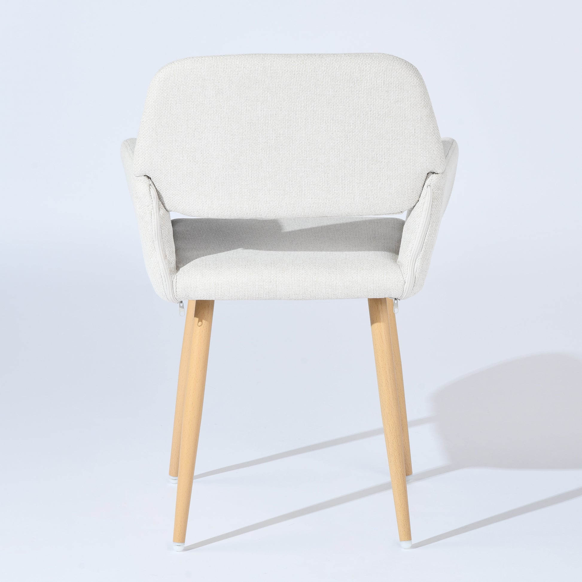Mayfair beige fabric dining chair with armrests on white background, rear view