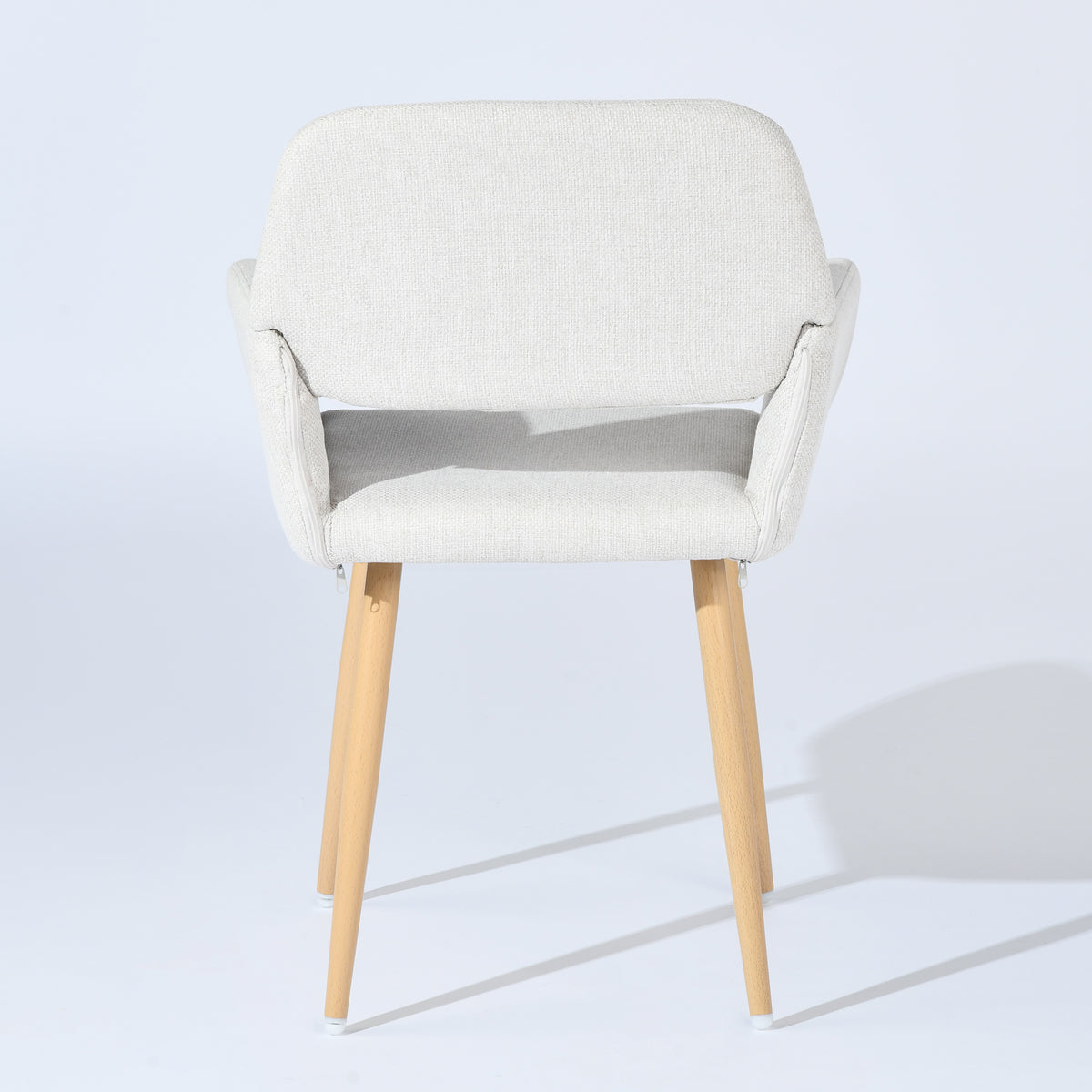 Mayfair beige fabric dining chair with armrests on white background, rear view