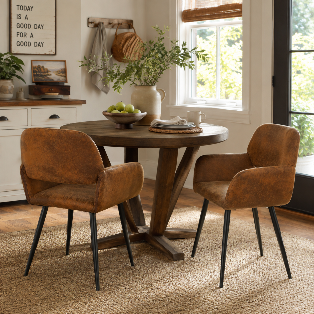 Mayfair suede brown dining chairs with armrests set of 2 around a round dining table in a dining room