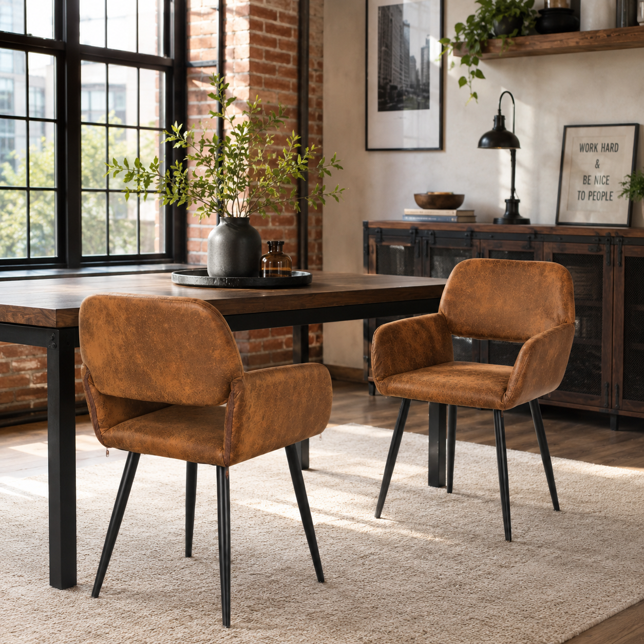 Mayfair suede brown dining chairs with armrests set of 2 with a round dining table in a warm dining room