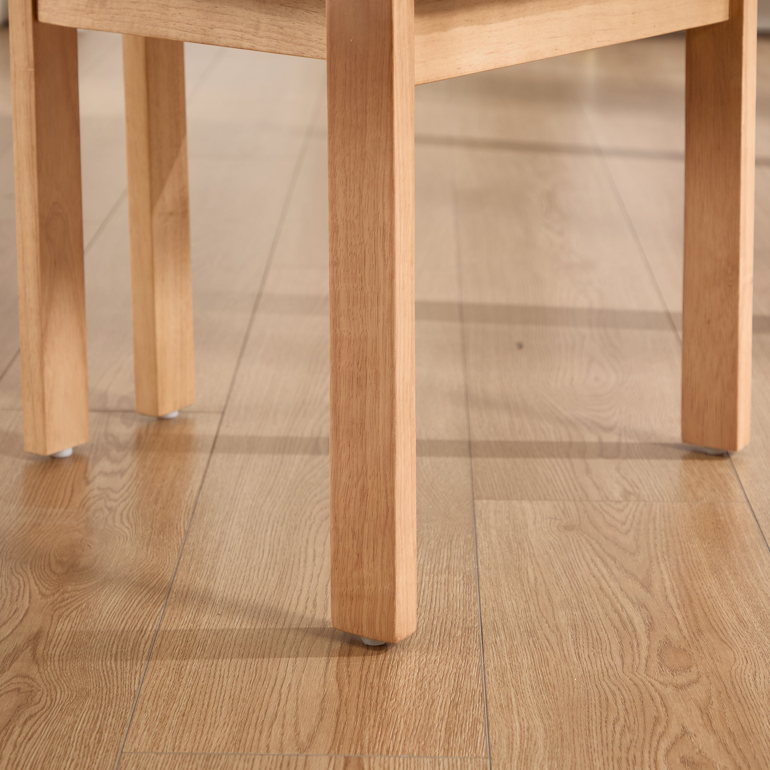 Michigan orange dining chair close-up of the chair leg and lower frame detail