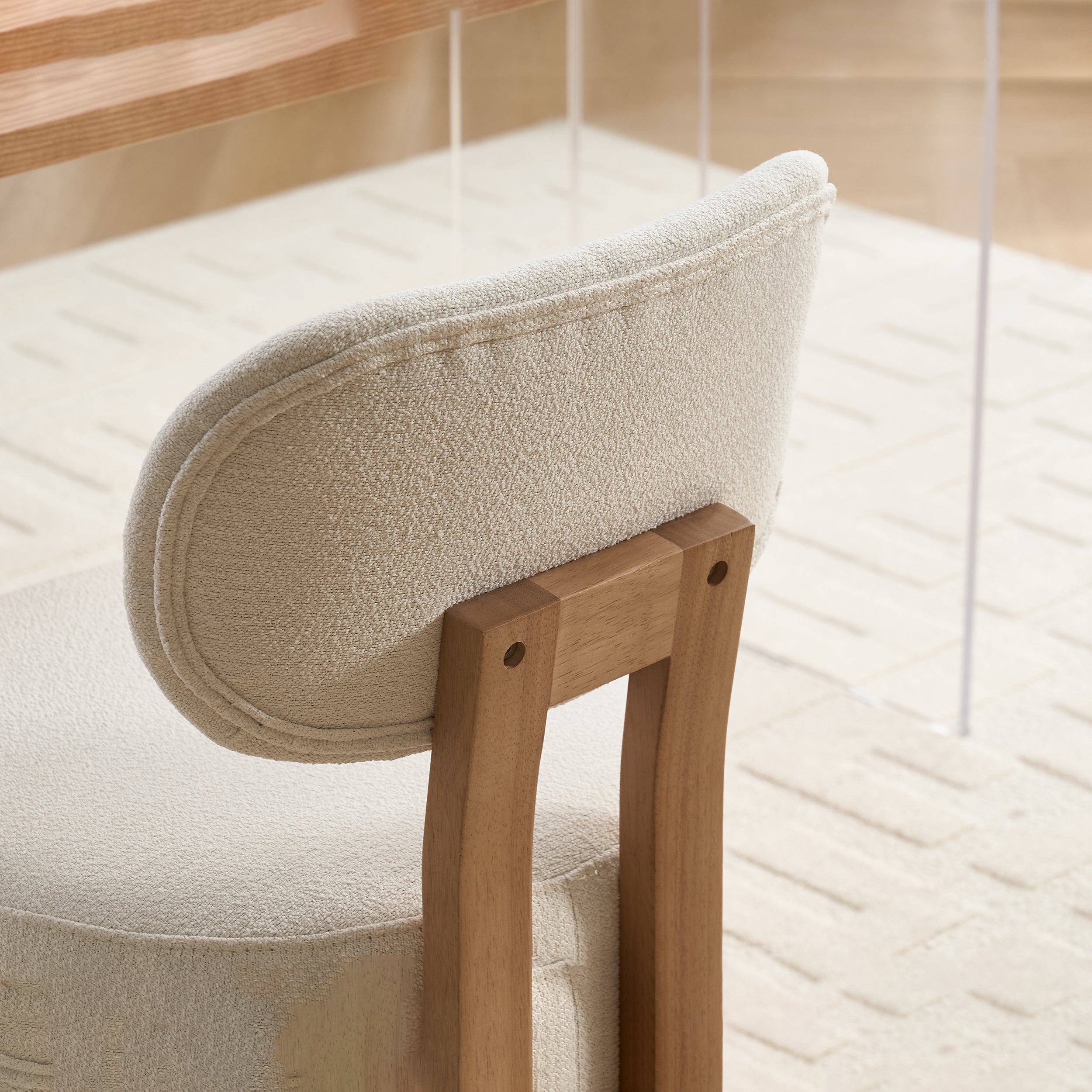 Michigan white dining chair close-up of the curved back and rear upholstery detail