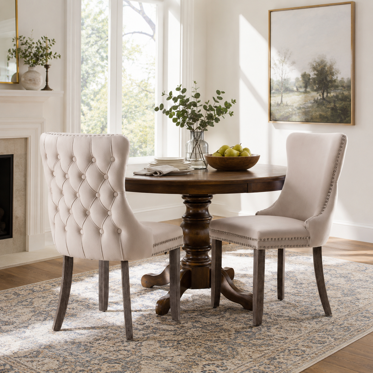 Missouri beige upholstered dining chairs with tufted backs around a round wood dining table