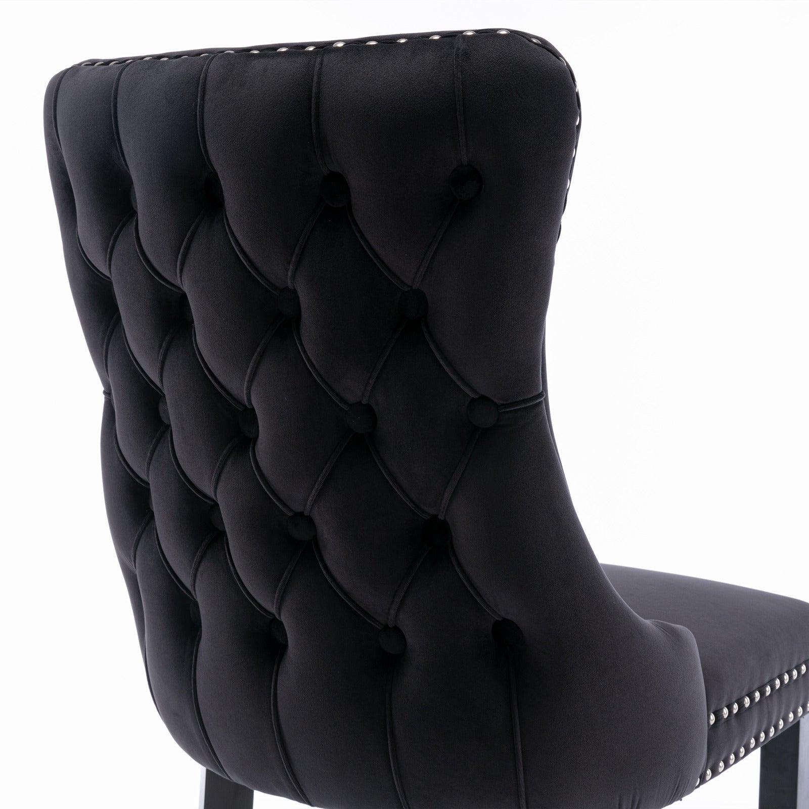 Missouri black dining chair close-up of the deep button tufted upholstered backrest