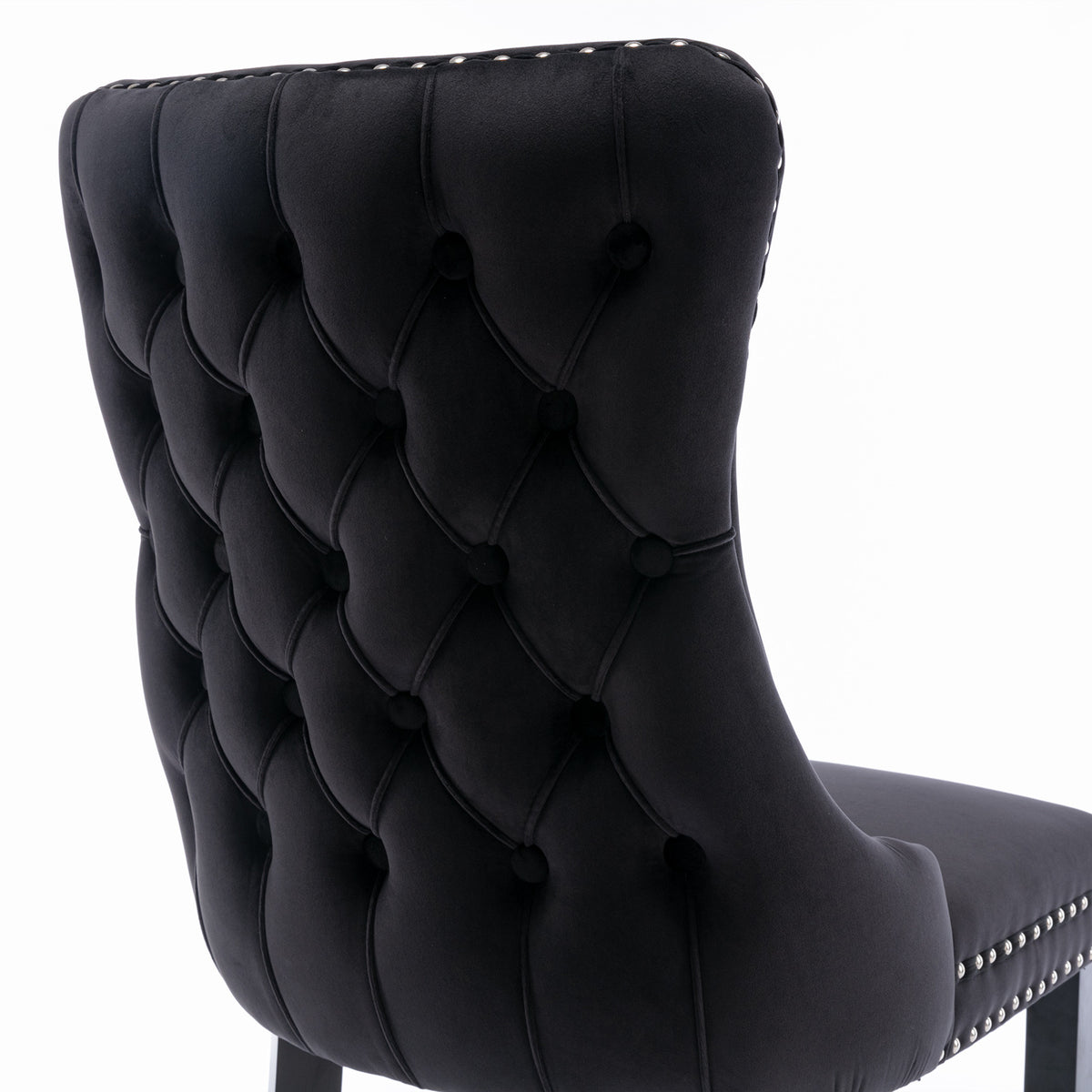 Missouri black dining chair close-up of the deep button tufted upholstered backrest