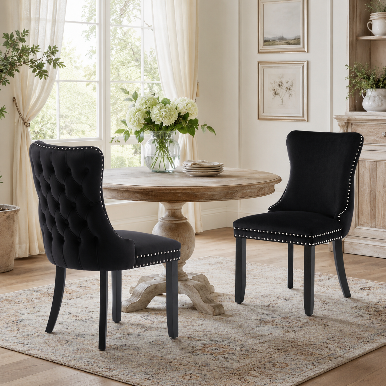 Missouri black tufted dining chairs in a bright dining room with a round wood table
