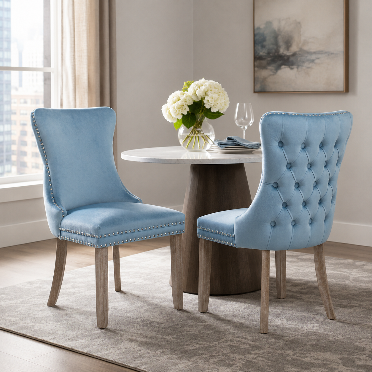 Missouri blue upholstered dining chairs with tufted backs in a bright dining room