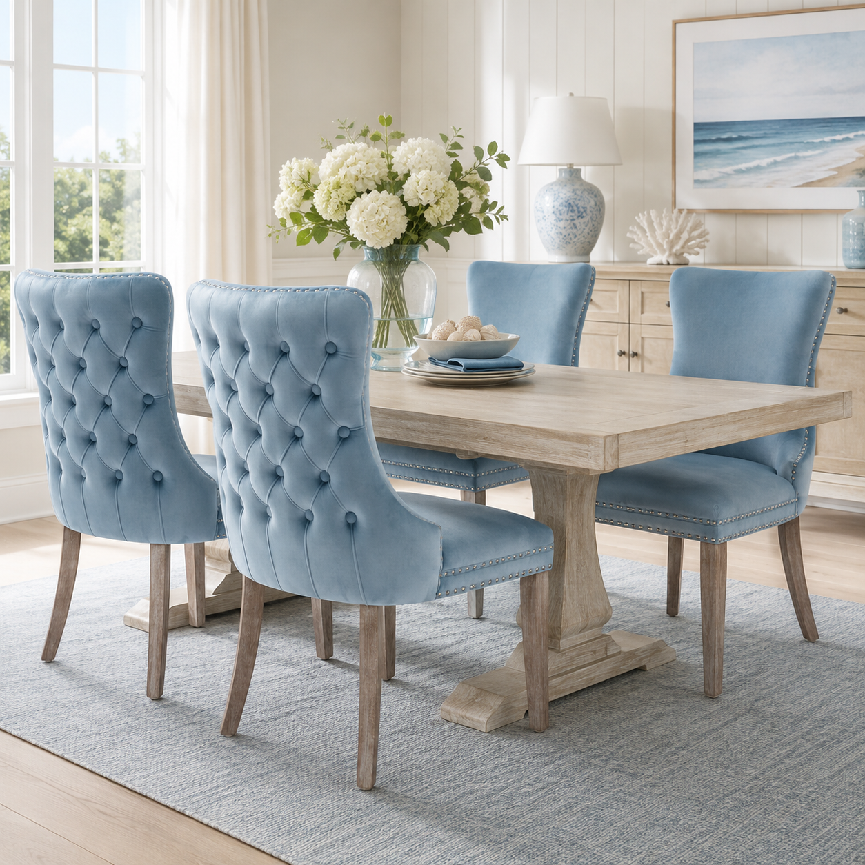 Missouri blue upholstered dining chairs around a wood table in a bright contemporary space