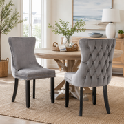 Missouri gray upholstered dining chairs with tufted backs around a wood dining table
