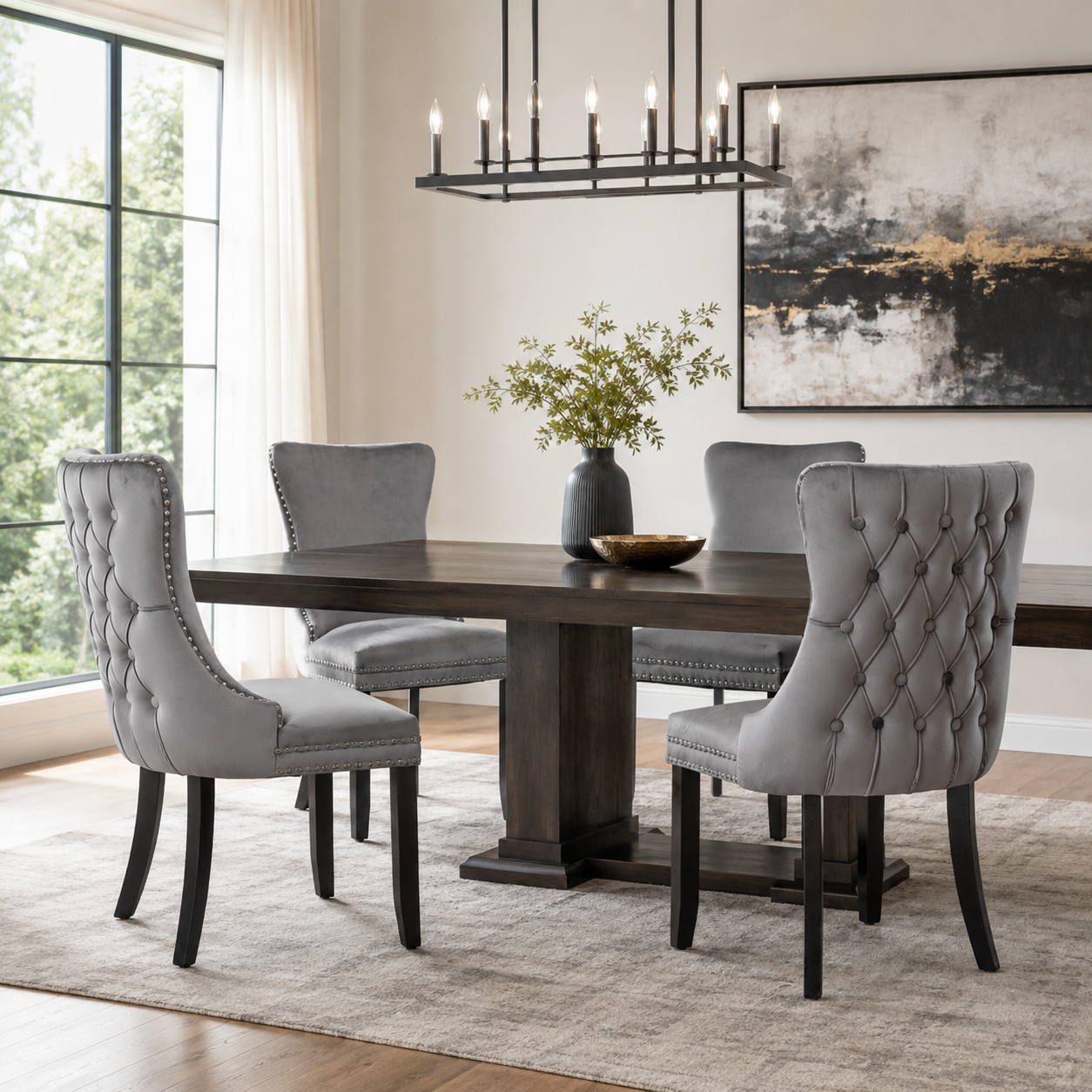 Missouri gray tufted dining chairs arranged around a dark wood dining table
