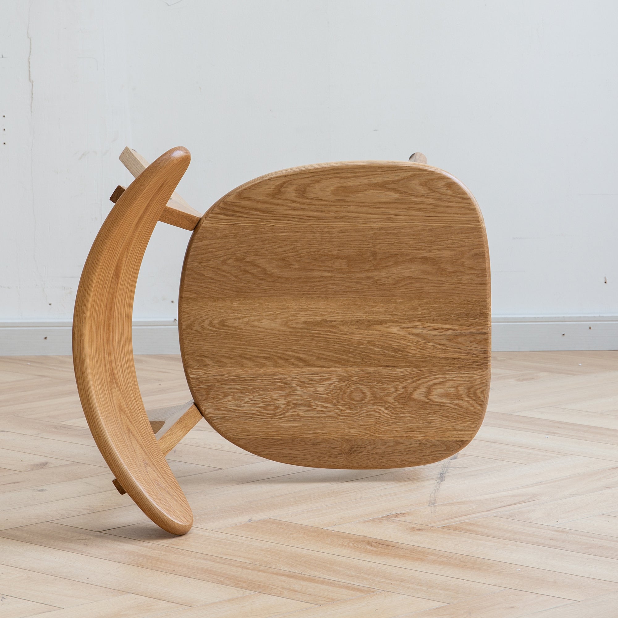 Mogan oak dining chair view showing the solid wood seat and support frame construction