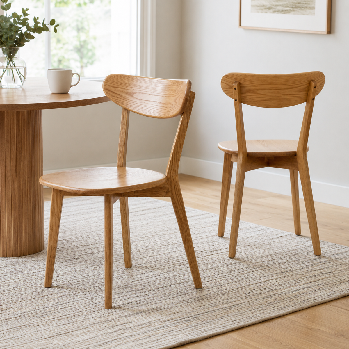 Mogan oak solid wood dining chairs set of two in a bright modern home dining space