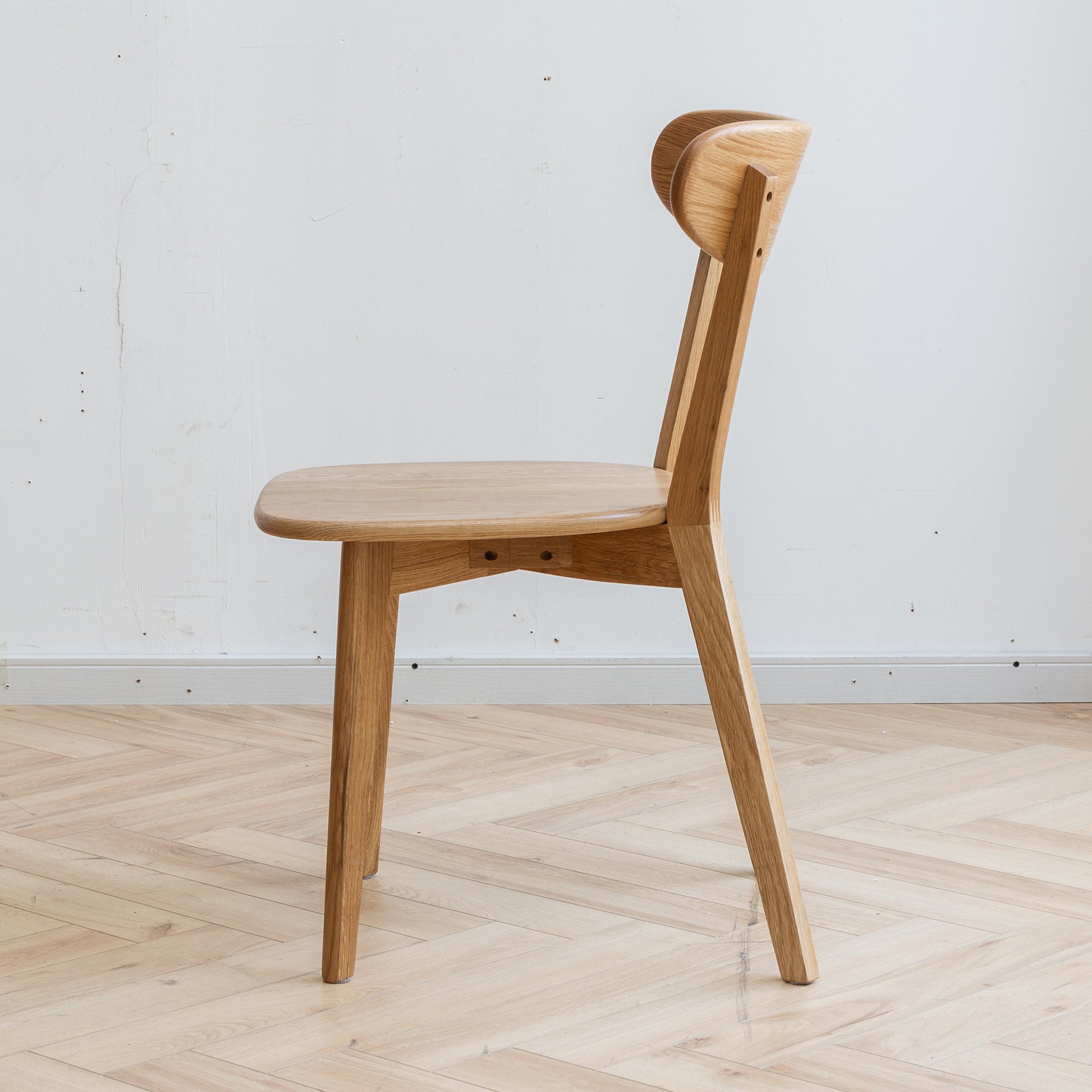 Mogan oak solid wood dining chair side view on white background