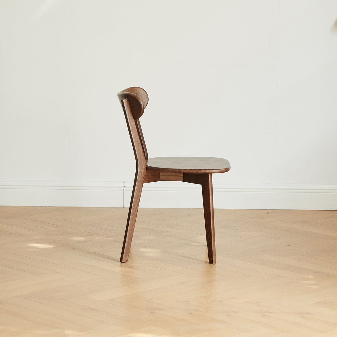 Mogan walnut solid wood dining chair side view on white background