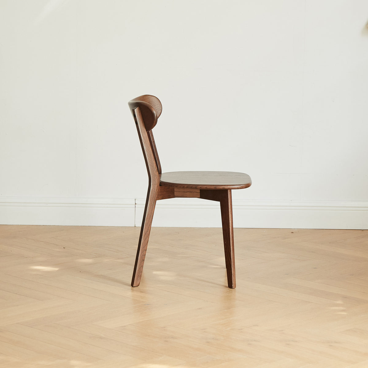Mogan walnut solid wood dining chair side view on white background