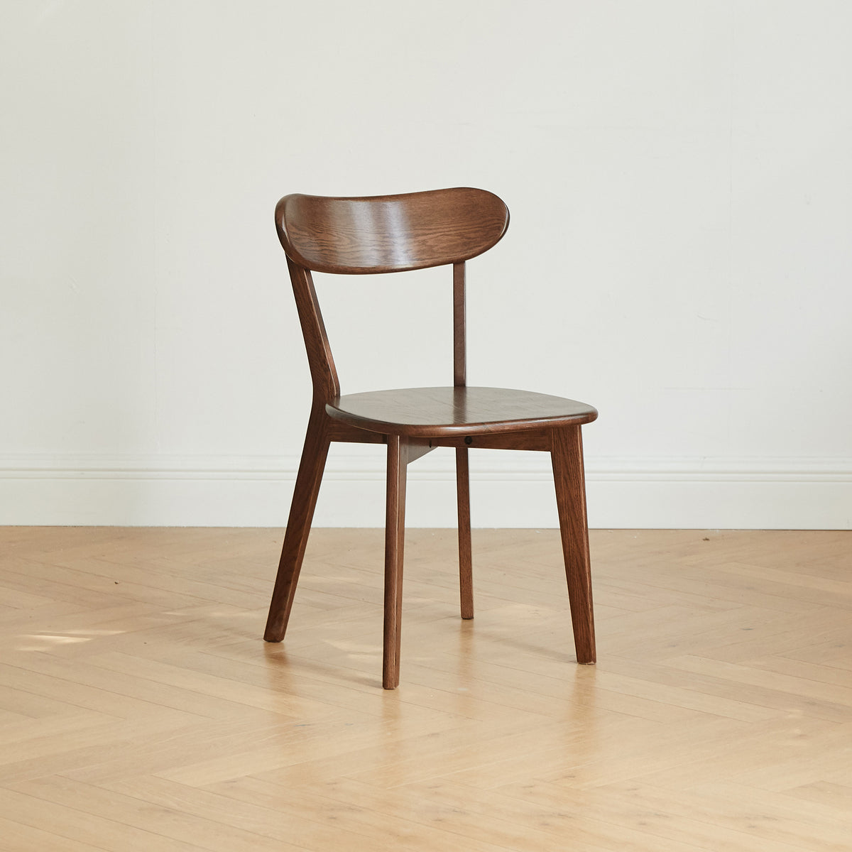 Mogan walnut solid wood dining chair front view showing curved backrest on white background