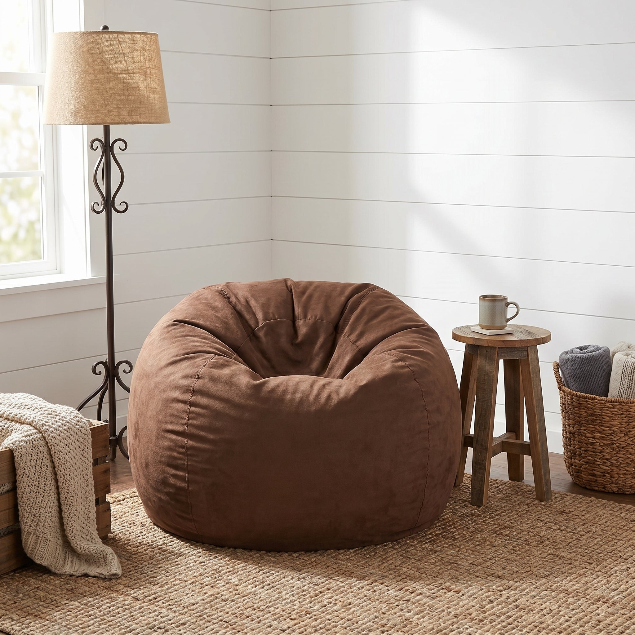 Mojave brown bean bag chair showing casual seating beside a floor lamp