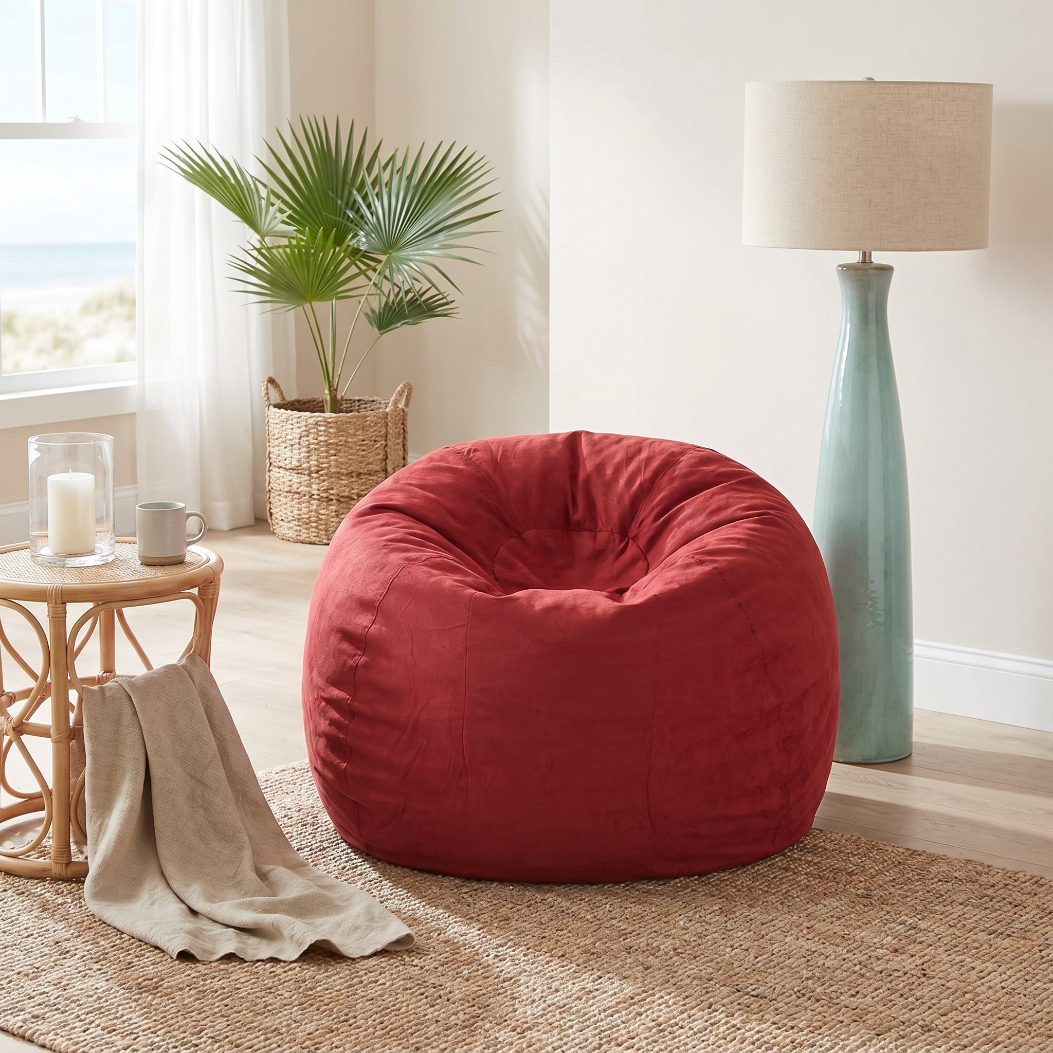 Mojave red bean bag chair showing relaxed seating beside a plant and floor lamp