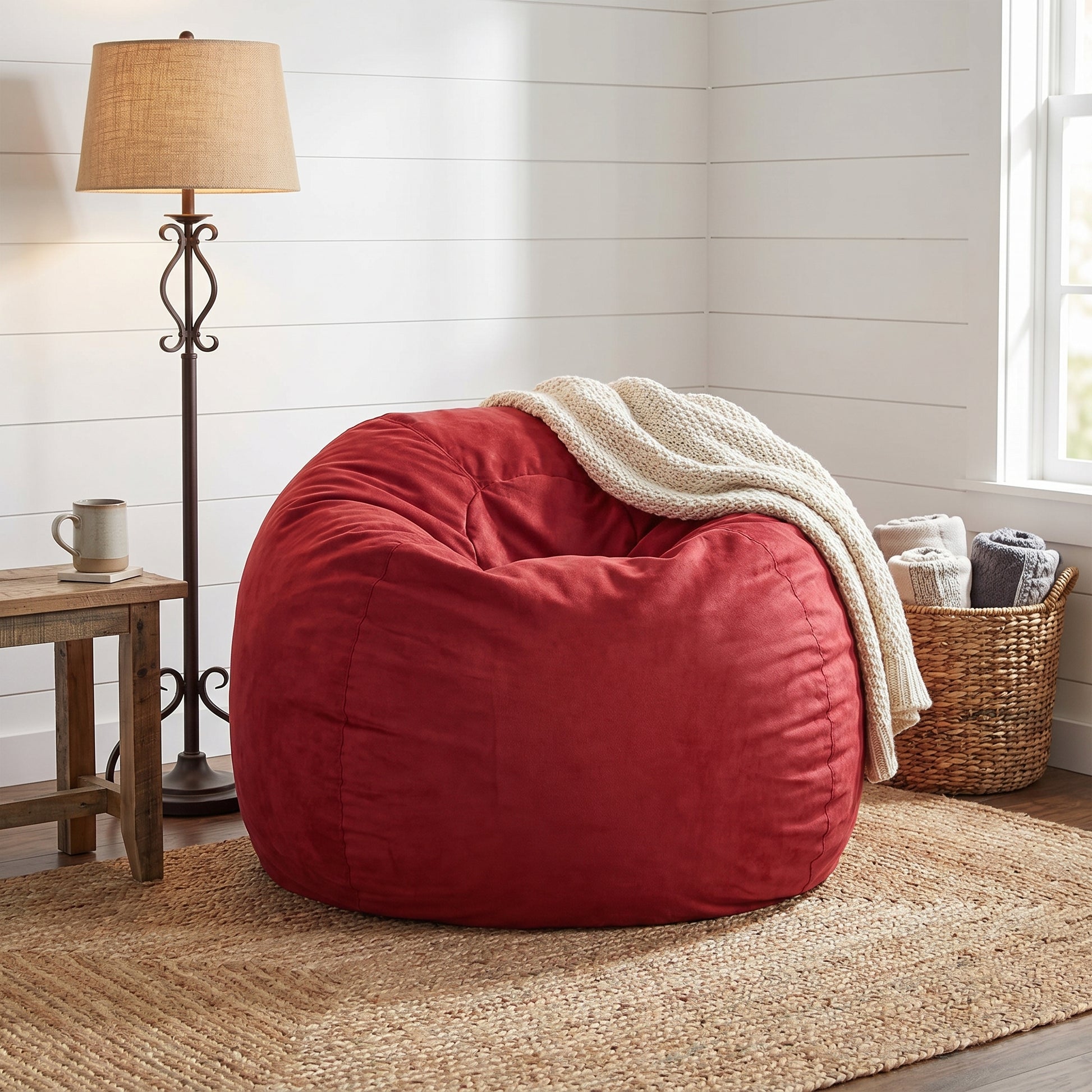 Mojave red bean bag chair showing cozy seating with a draped throw blanket