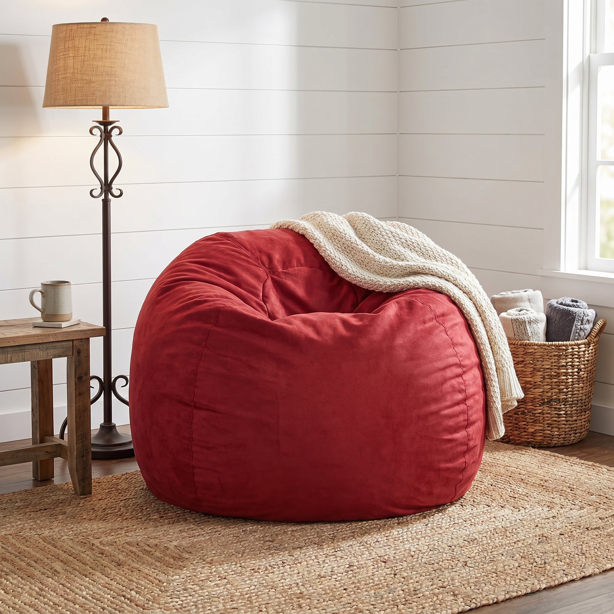 Mojave red bean bag chair showing cozy seating with a draped throw blanket