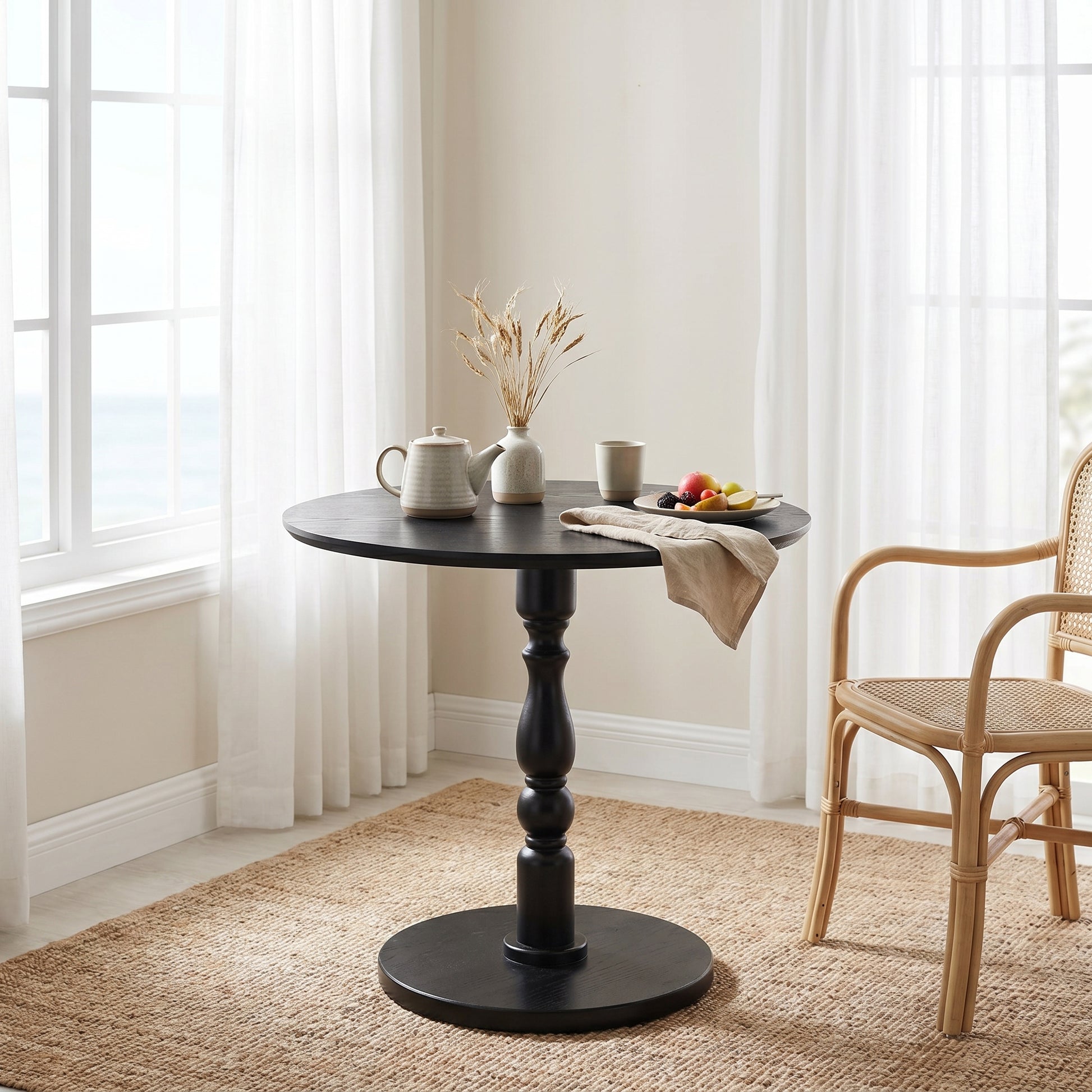 Monaco black side table showing a round accent table in a bright corner setting