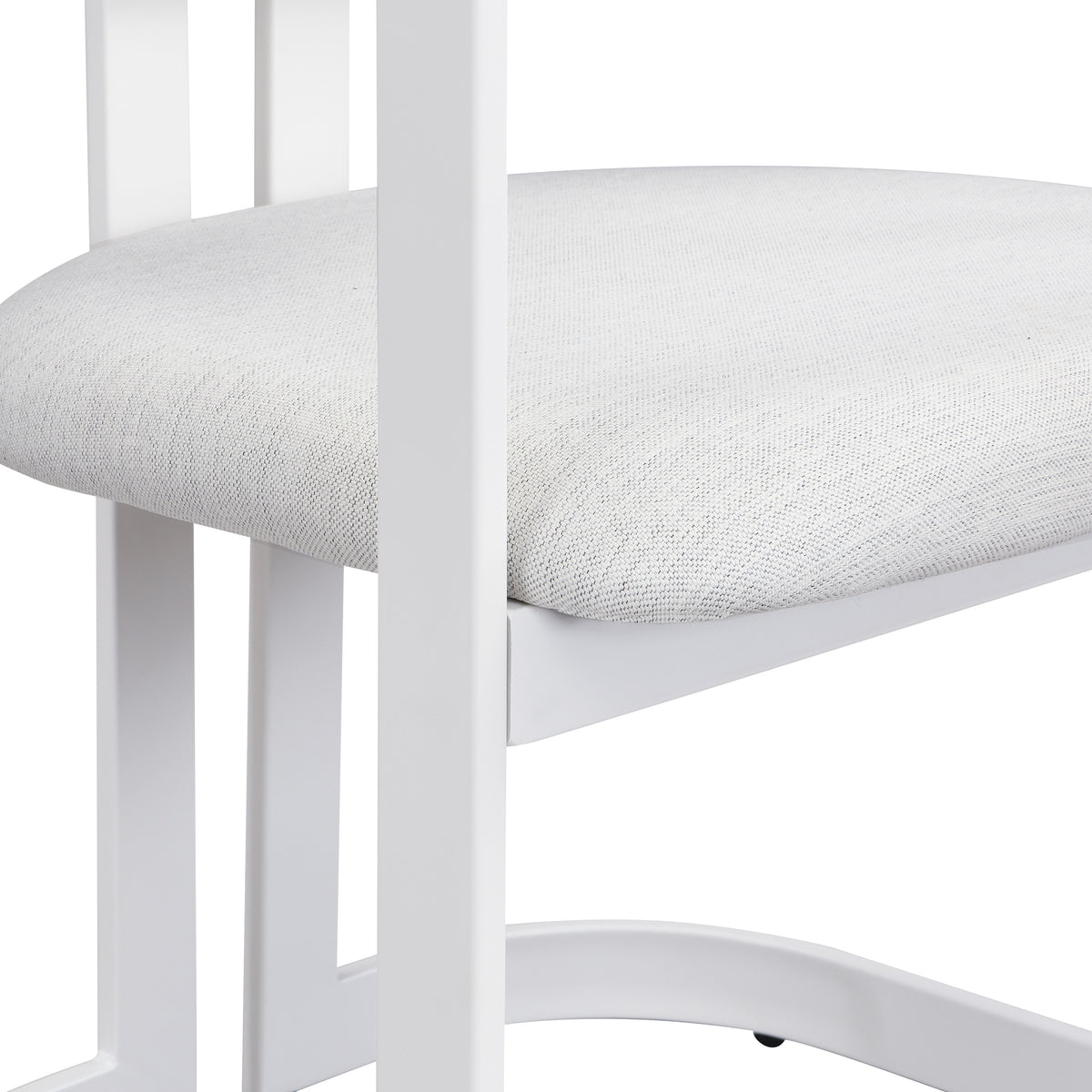 Morava white upholstered metal dining armchair showing curved back and seat profile detail
