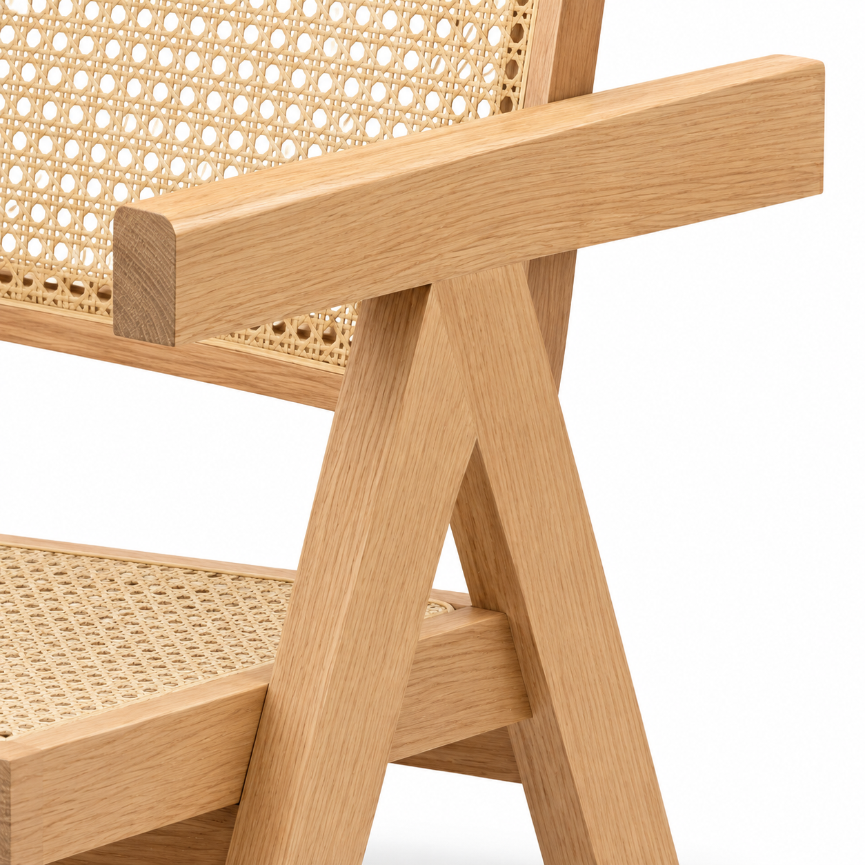 Mosel natural dining chair close-up of the woven rattan seat and solid wood armrest