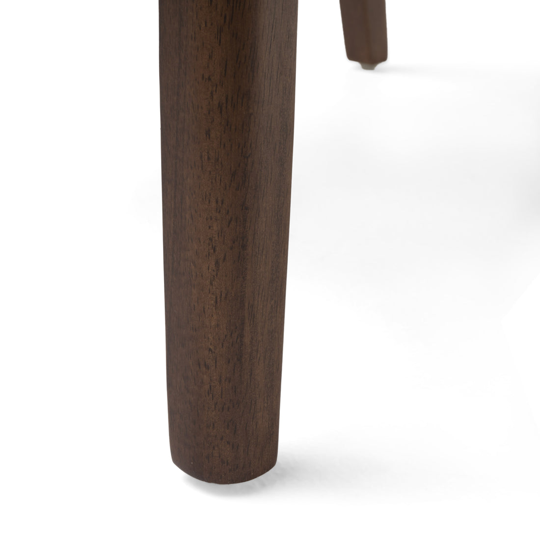 Nakuru white dining chair close-up of the solid rubberwood leg and floor protector